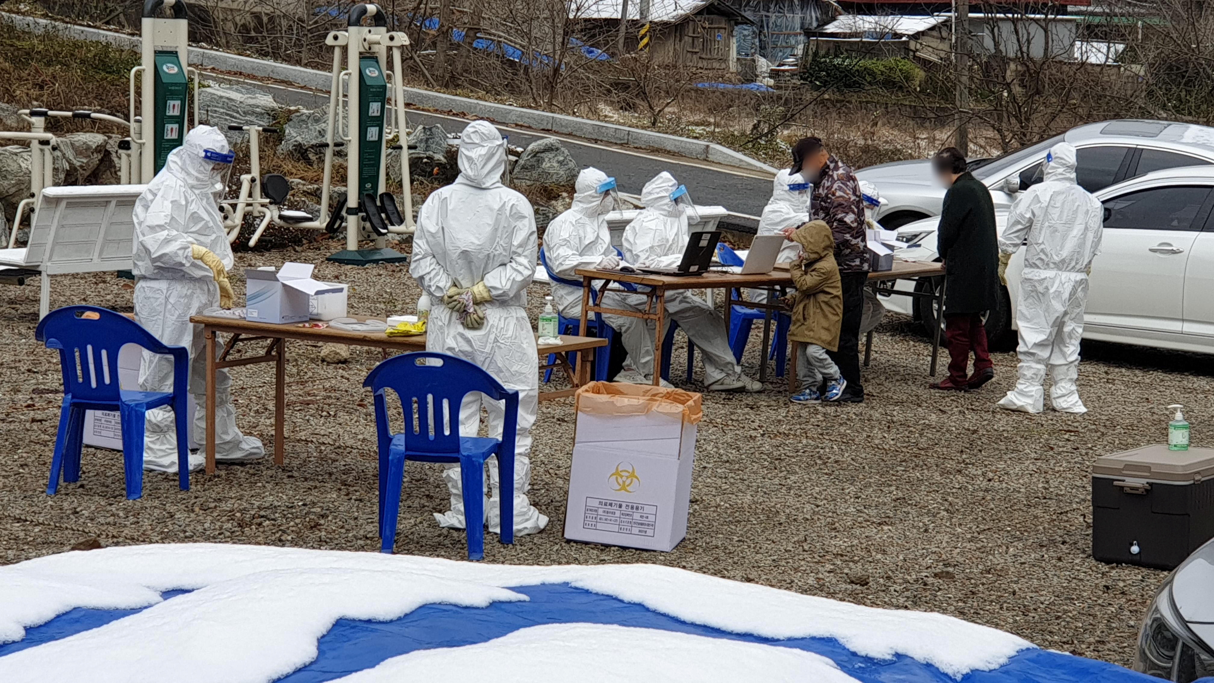 Residents in a religious community where many people had tested positive for the coronavirus disease (COVID-19) arrive to undergo the coronavirus test in Cheonan, South Korea, November 23, 2021. Picture taken November 23, 2021. Yonhap via REUTERS   