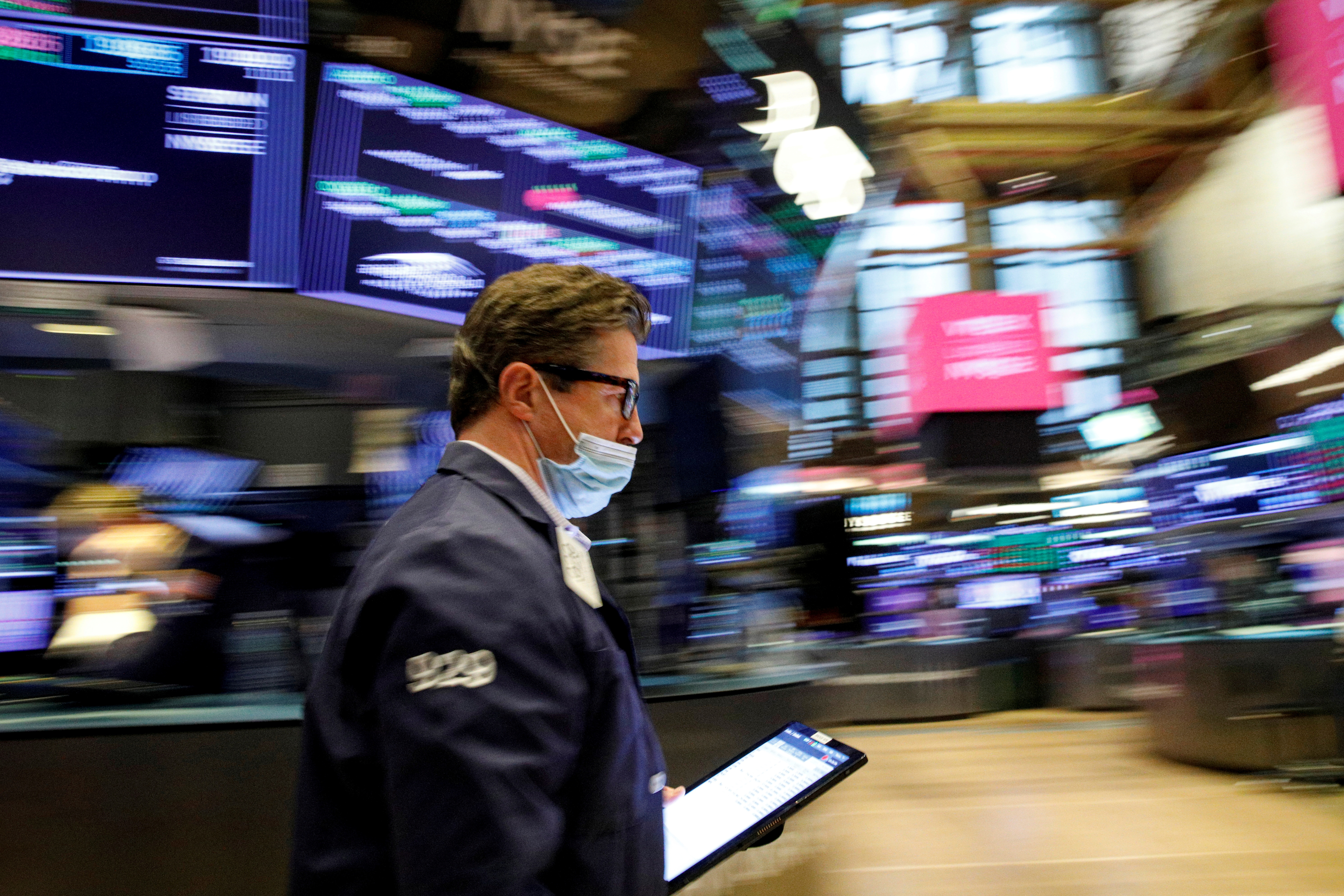 A trader works on the floor of the NYSE in New York