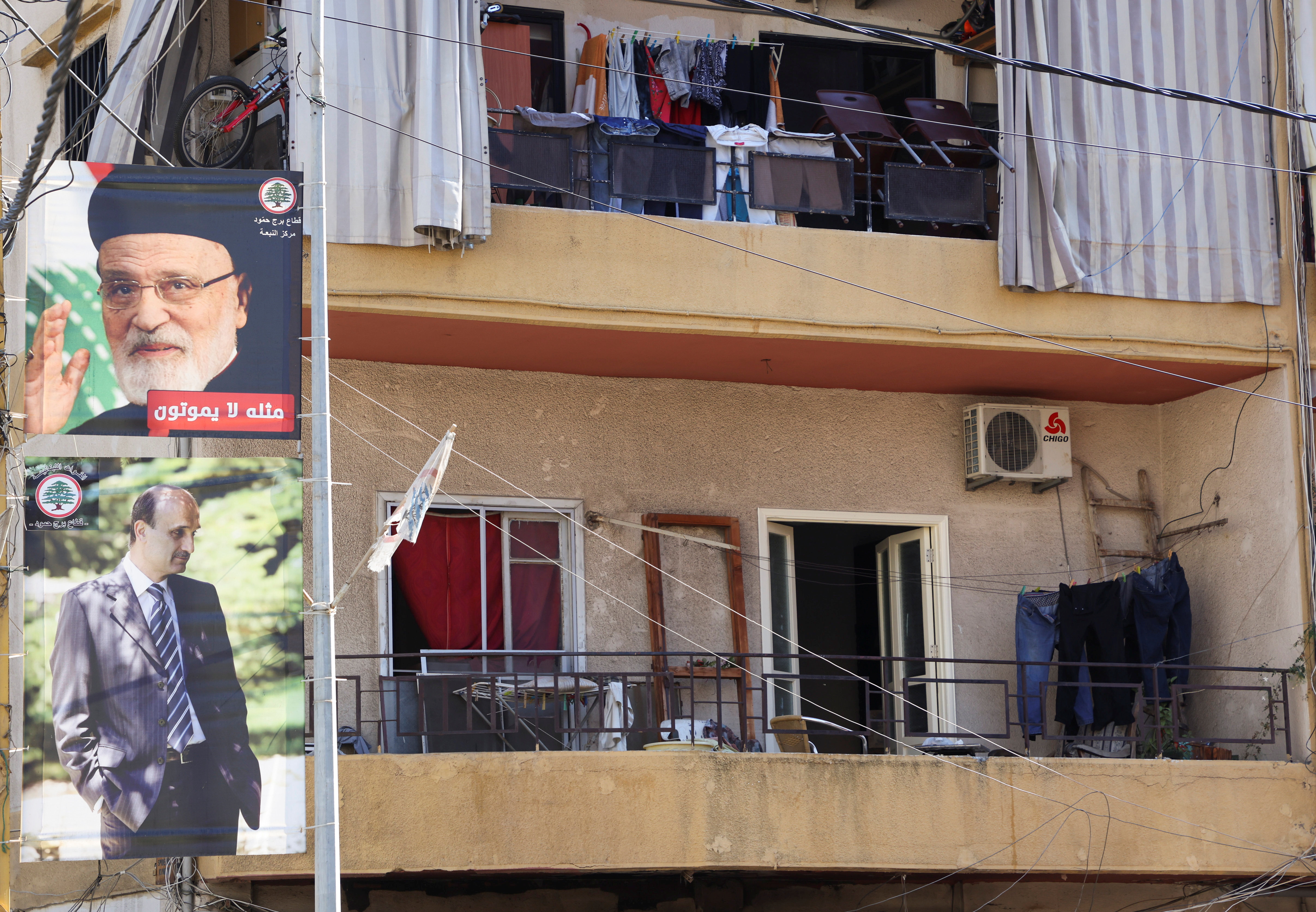 A poster depicting former Lebanon's Christian Maronite Patriarch Mar Nasrallah Boutros Sfeir and Christian Lebanese Forces party leader Samir Geagea, is seen in Sin El Fil, Lebanon October 21, 2021. REUTERS/Mohamed Azakir