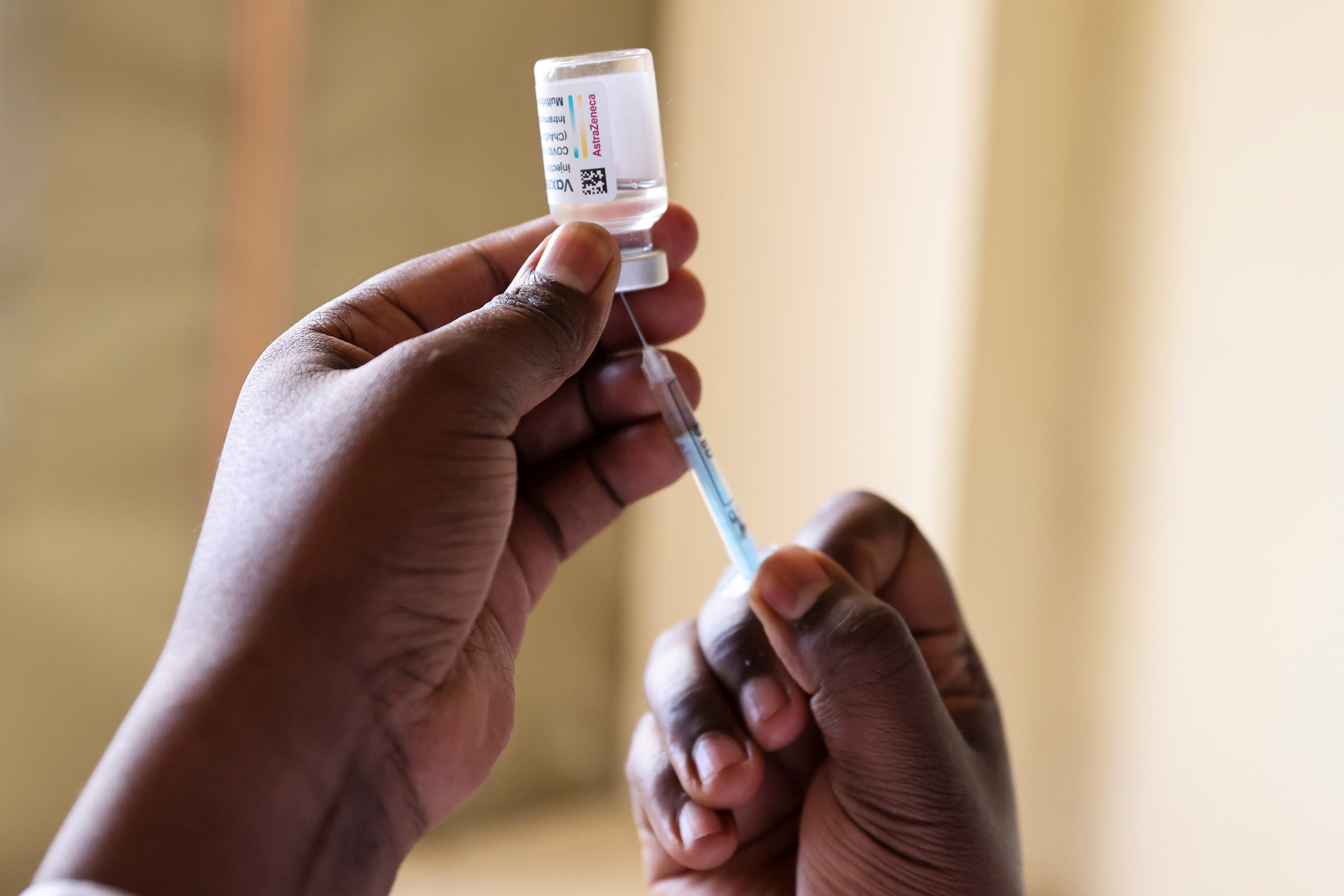 Healthcare professional prepares a dose of AstraZeneca (COVID-19) vaccine, in Talek
