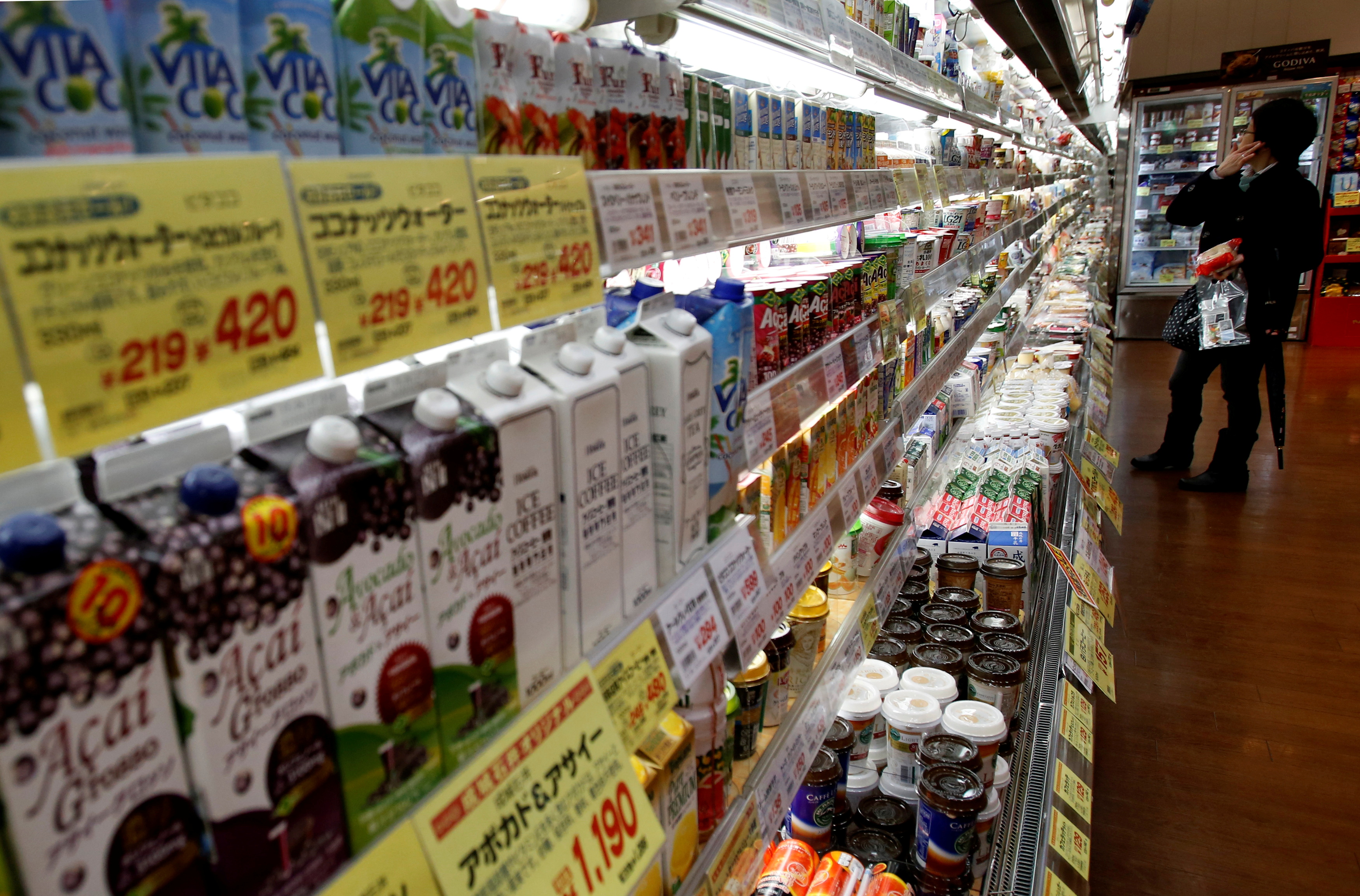 A shopper looks at items at a supermarket in Tokyo February 26, 2015. REUTERS/Yuya Shino/File Photo/File Photo