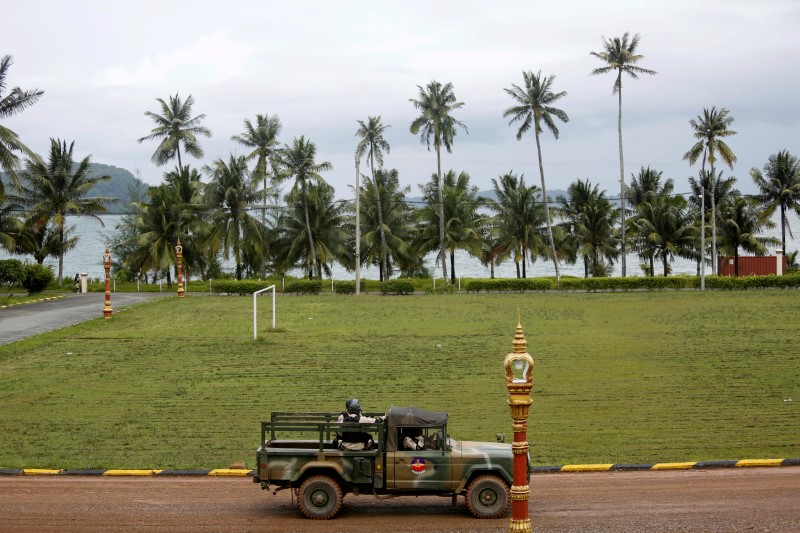 Sailors sit on a truck at the Cambodian Ream Naval Base in Sihanoukville