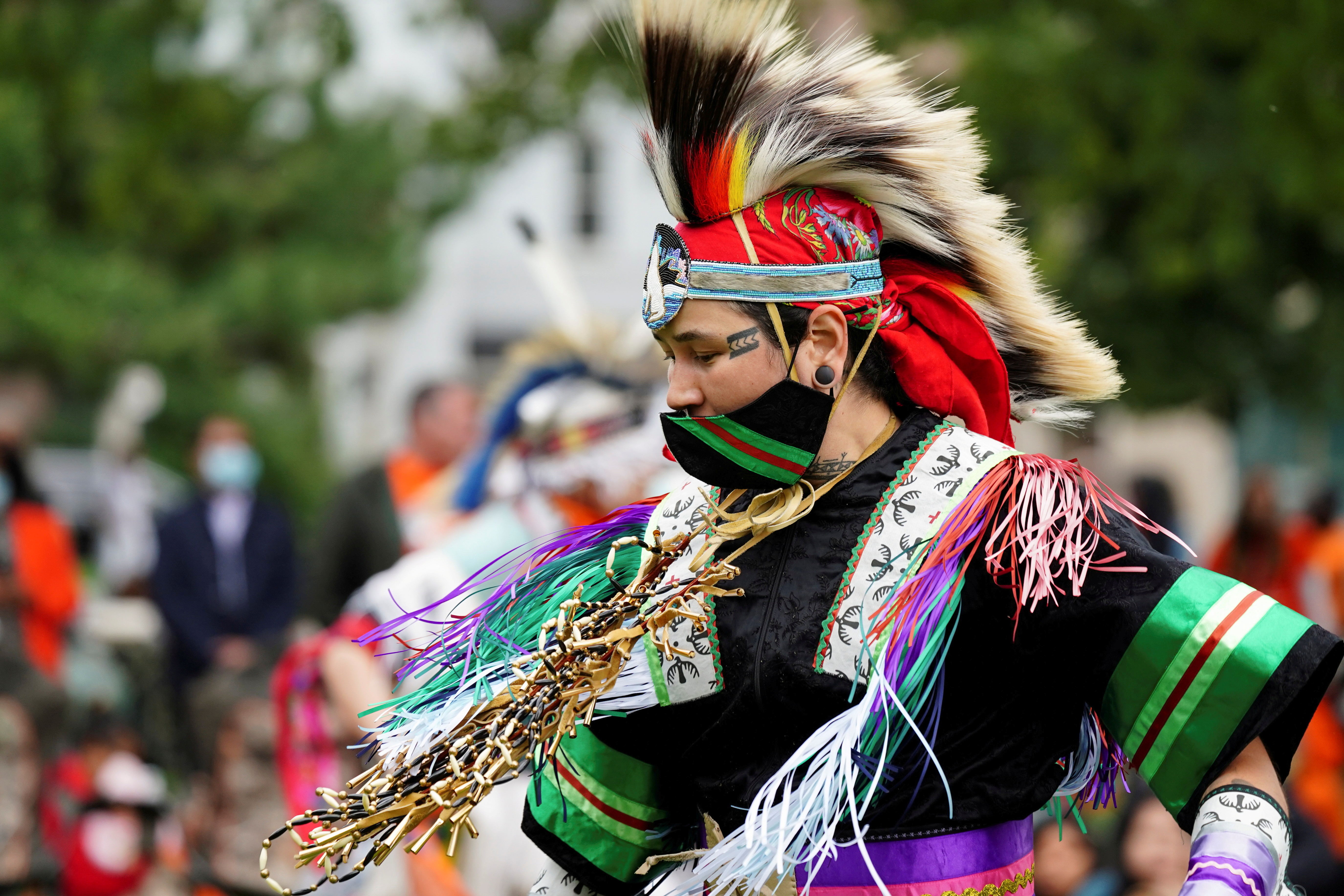 Nanook Gordon, from Inuvik, dances while wearing grass dance regalia during Canada's first National Day for Truth and Reconciliation, honouring the lost children and survivors of Indigenous residential schools, their families and communities, in Toronto, Ontario, Canada September 30, 2021. REUTERS/Carlos Osorio 