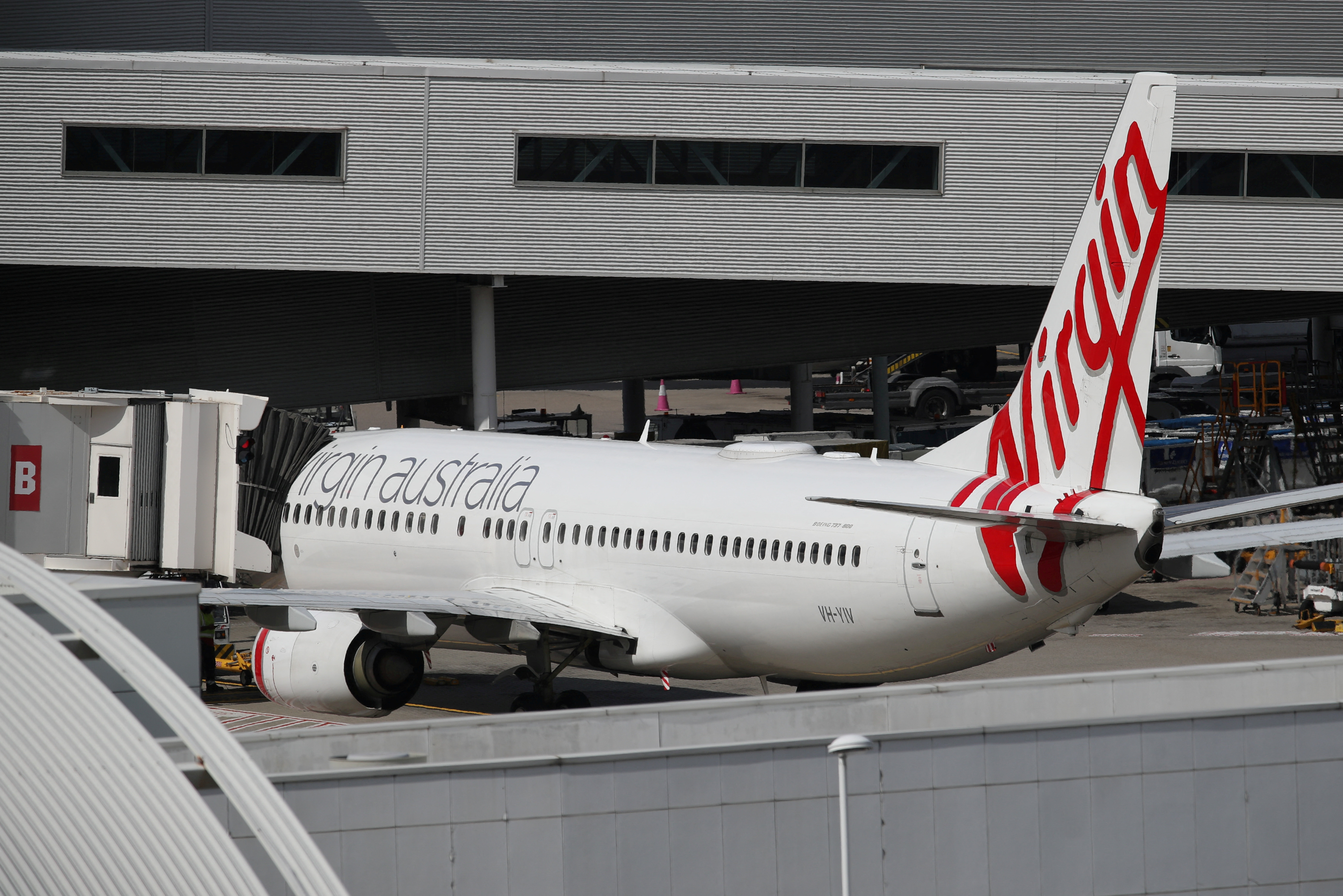 A Virgin Australia Airlines plane is seen at Kingsford Smith International Airport after Australia implemented an entry ban on non-citizens and non-residents due to the coronavirus disease (COVID-19) in Sydney