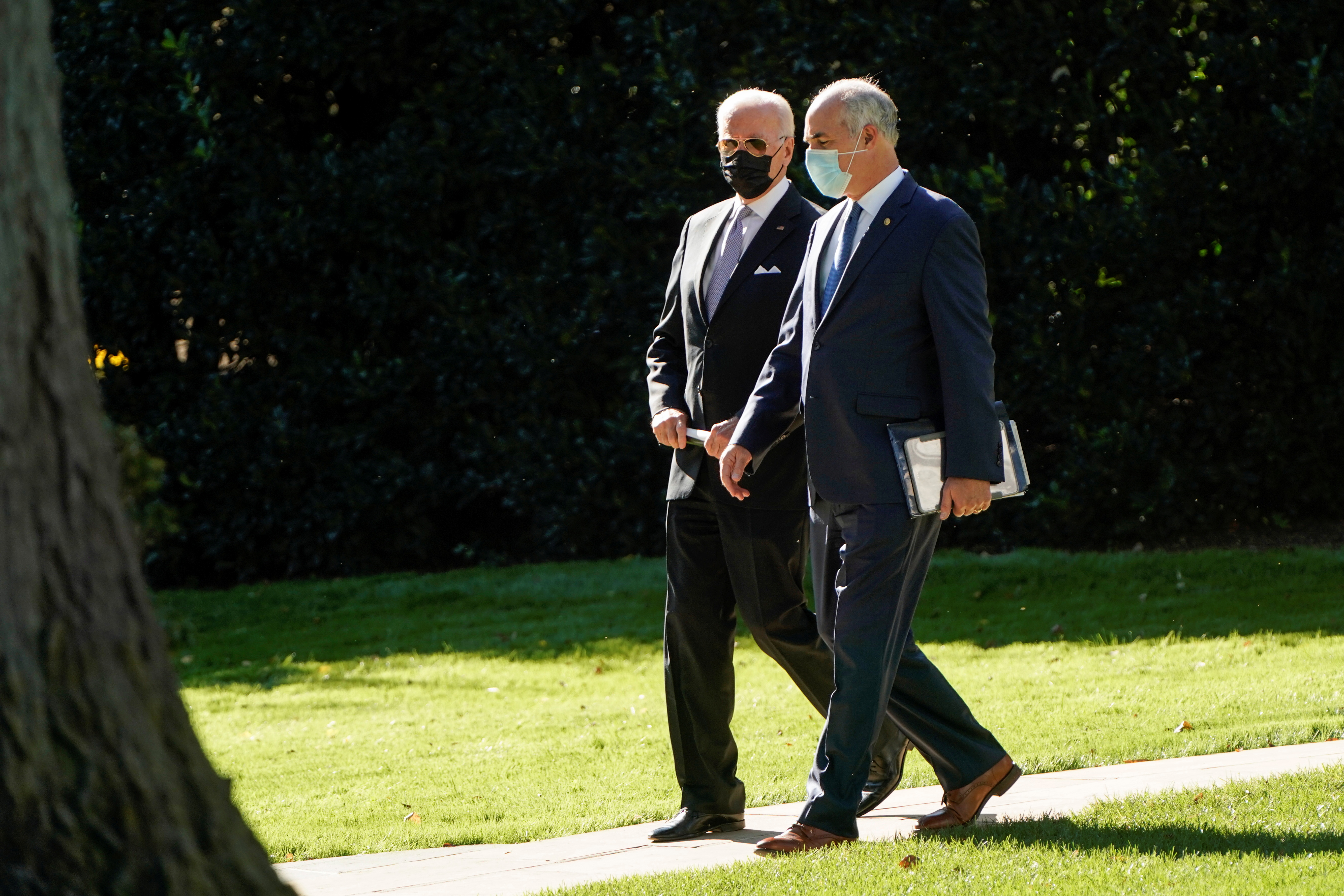 U.S. President Joe Biden walks with Senator Robert Casey (D-PA) to Marine One as they departs for Scranton, Pennsylvania, from the White House in Washington, U.S., October 20, 2021.      REUTERS/Joshua Roberts
