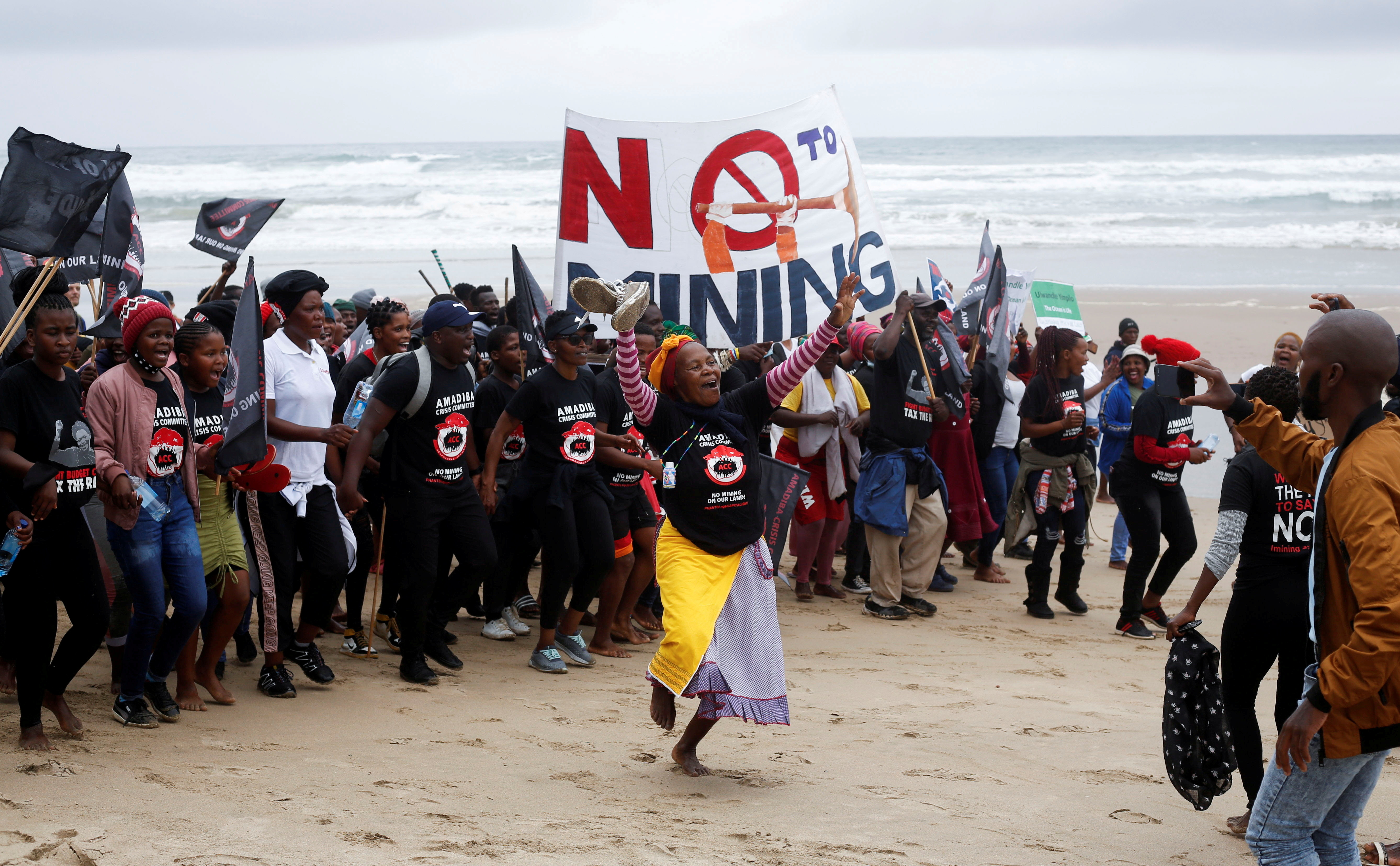 Wild Coast residents demonstrate against Royal Dutch Shell's plans to start seismic surveys to explore petroleum systems off the country's popular Wild Coast at Mzamba Beach, Sigidi, South Africa, December 5, 2021. REUTERS/Rogan Ward