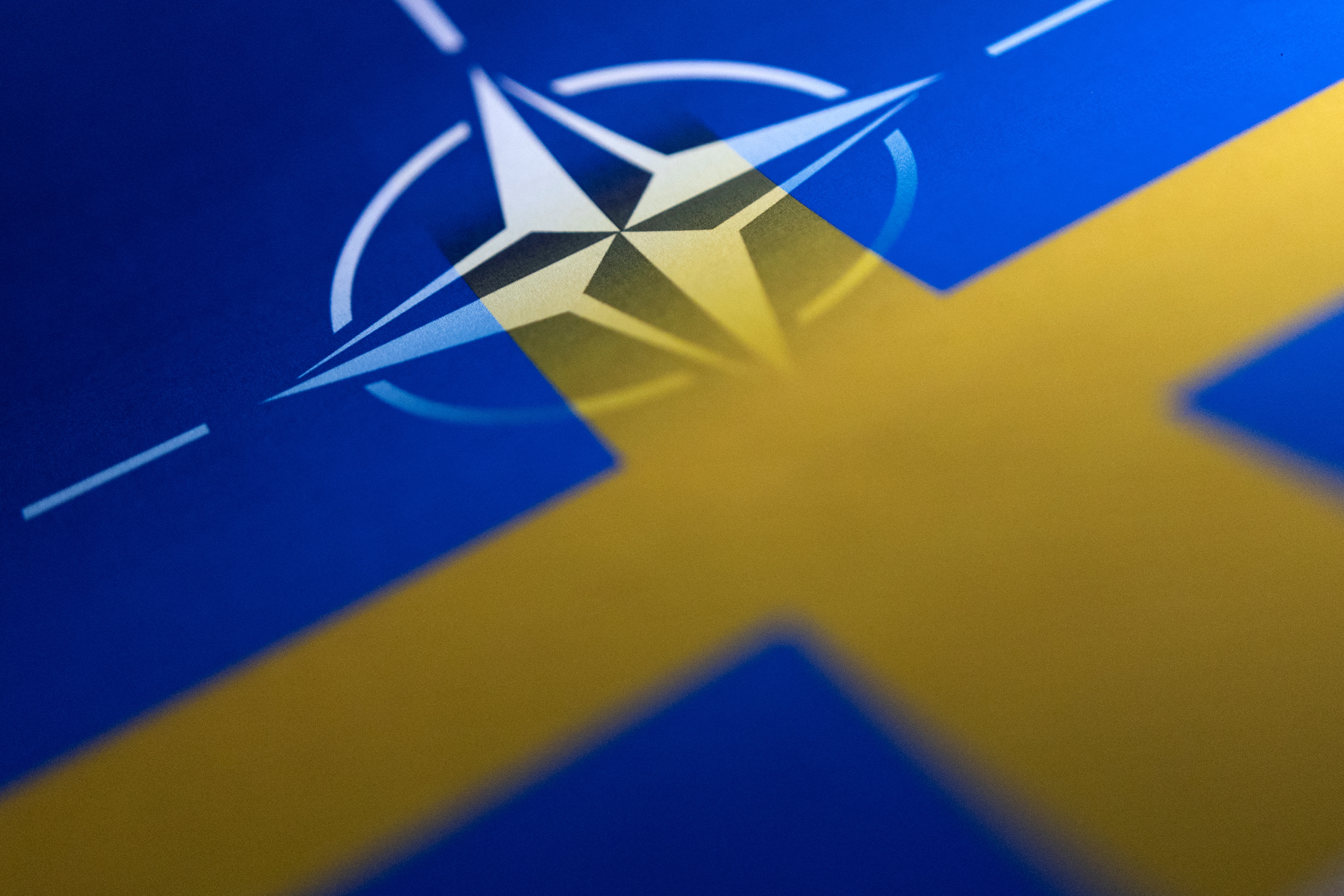 Illustration shows Swedish and NATO flags