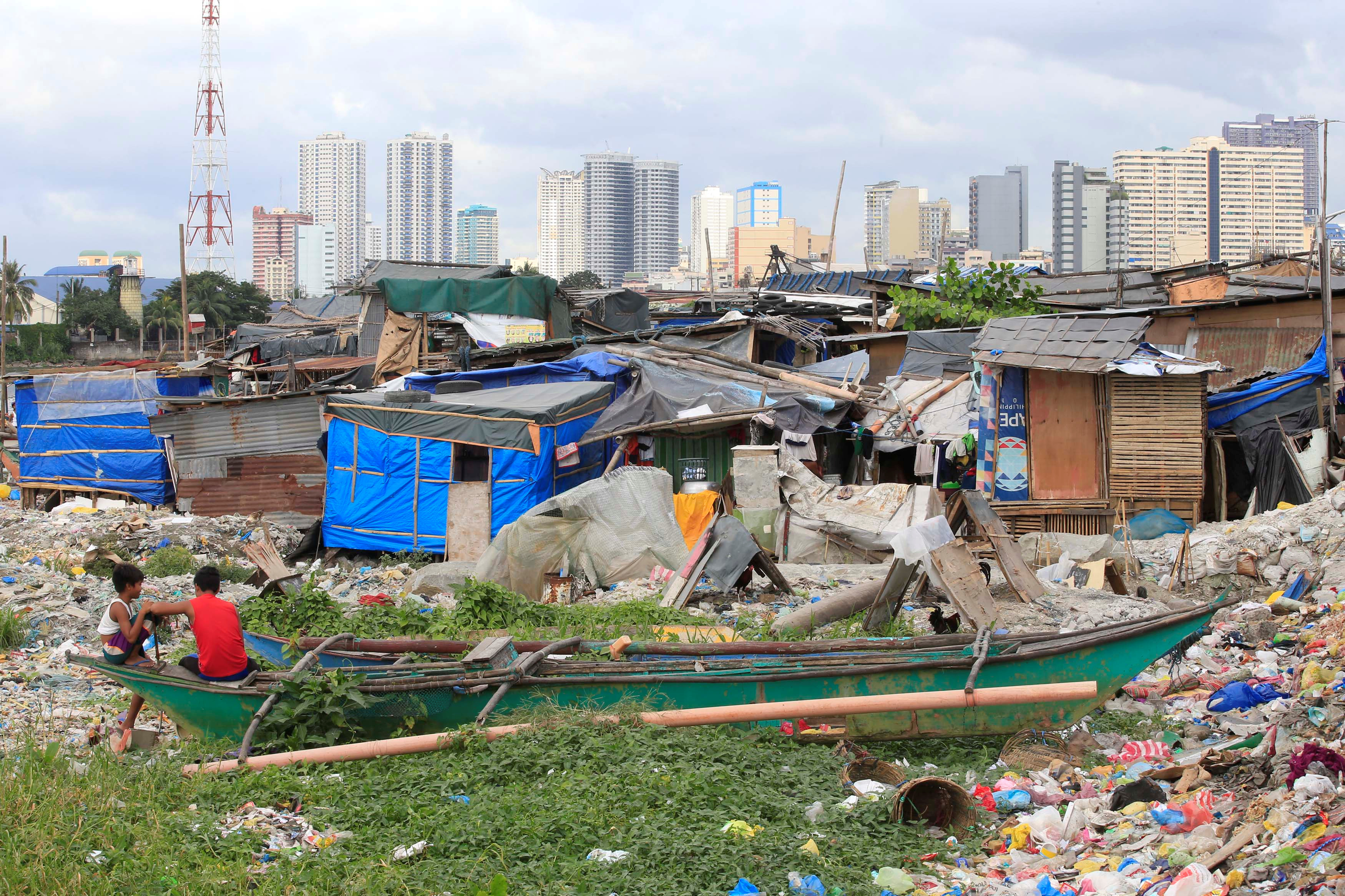 Youths are pictured at at a slum area in Baseco, Tondo city, metro Manila