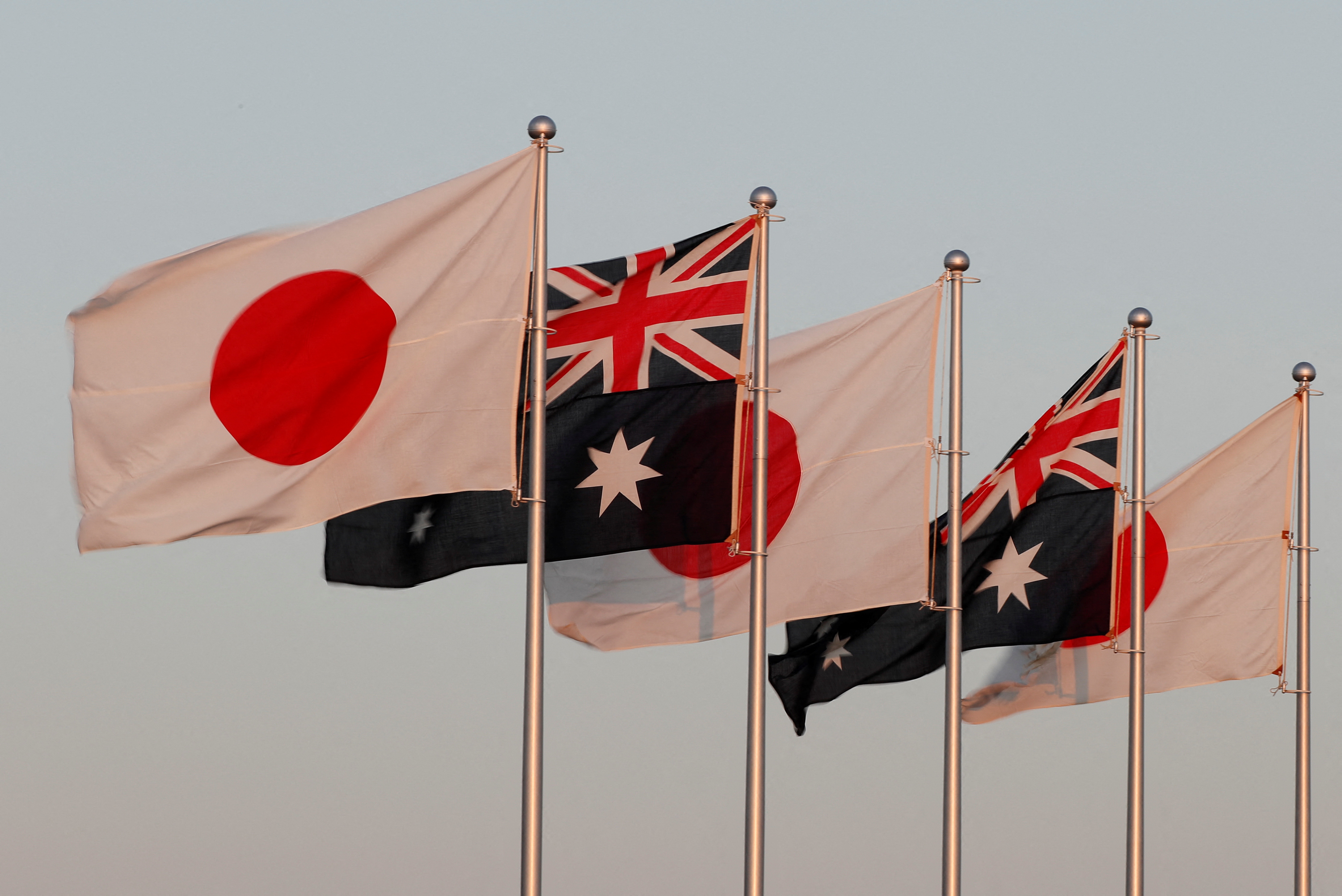 Japanese and Australian flags are pictured before the arrival of Australian Prime Minister Scott Morrison at Haneda airport in Tokyo, Japan November 17, 2020.  REUTERS/Issei Kato