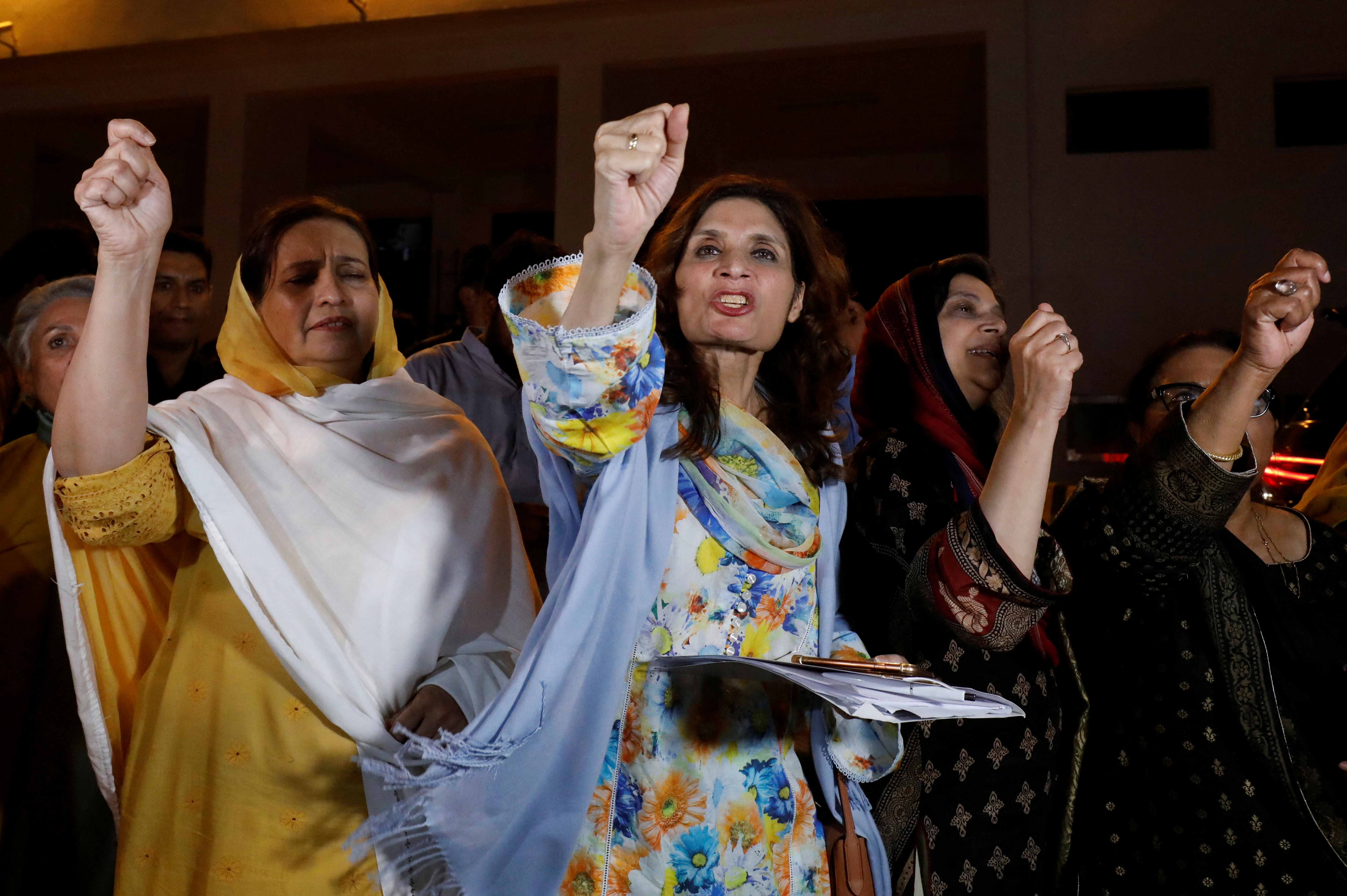 Supporters of former Pakistani Prime Minister Imran Khan chant slogans as they protest after he lost a confidence vote in the lower house of parliament, in Islamabad