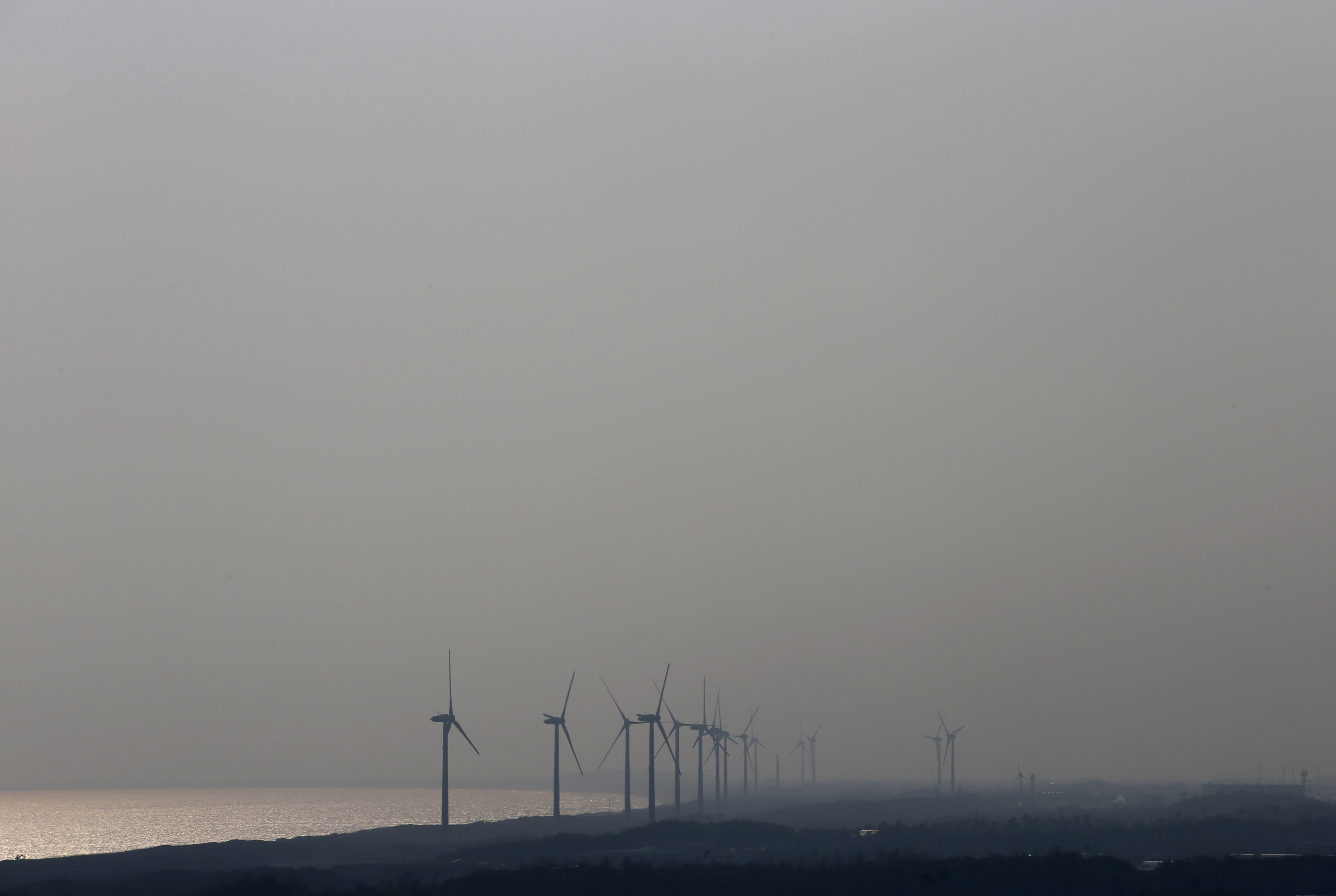 Wind turbines at Chubu Electric Power Co.'s Omaezaki Wind Power Station are seen from the company's Hamaoka Nuclear Power Station in Omaezaki