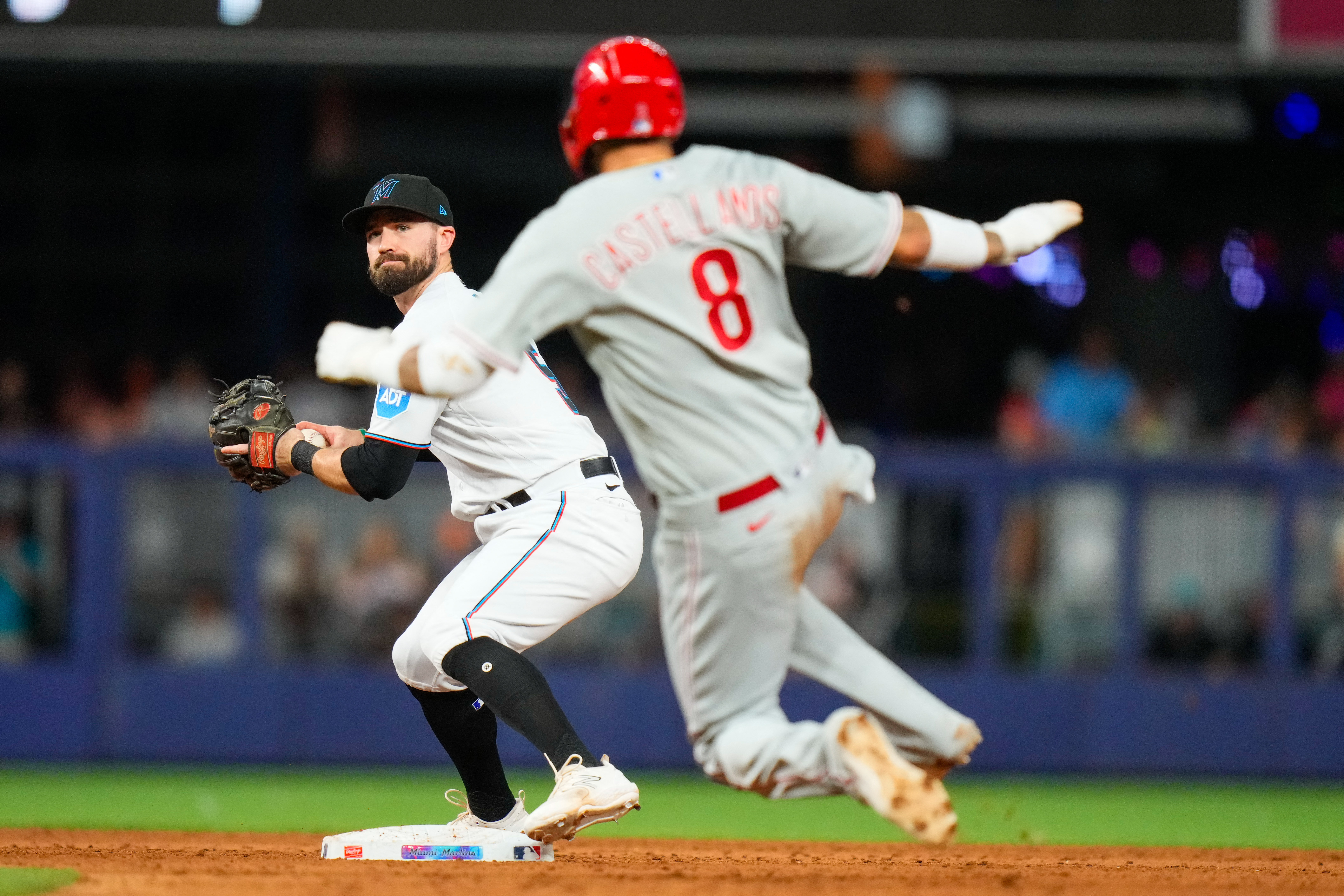 Marlins overcome three deficits, beat Phillies in 12