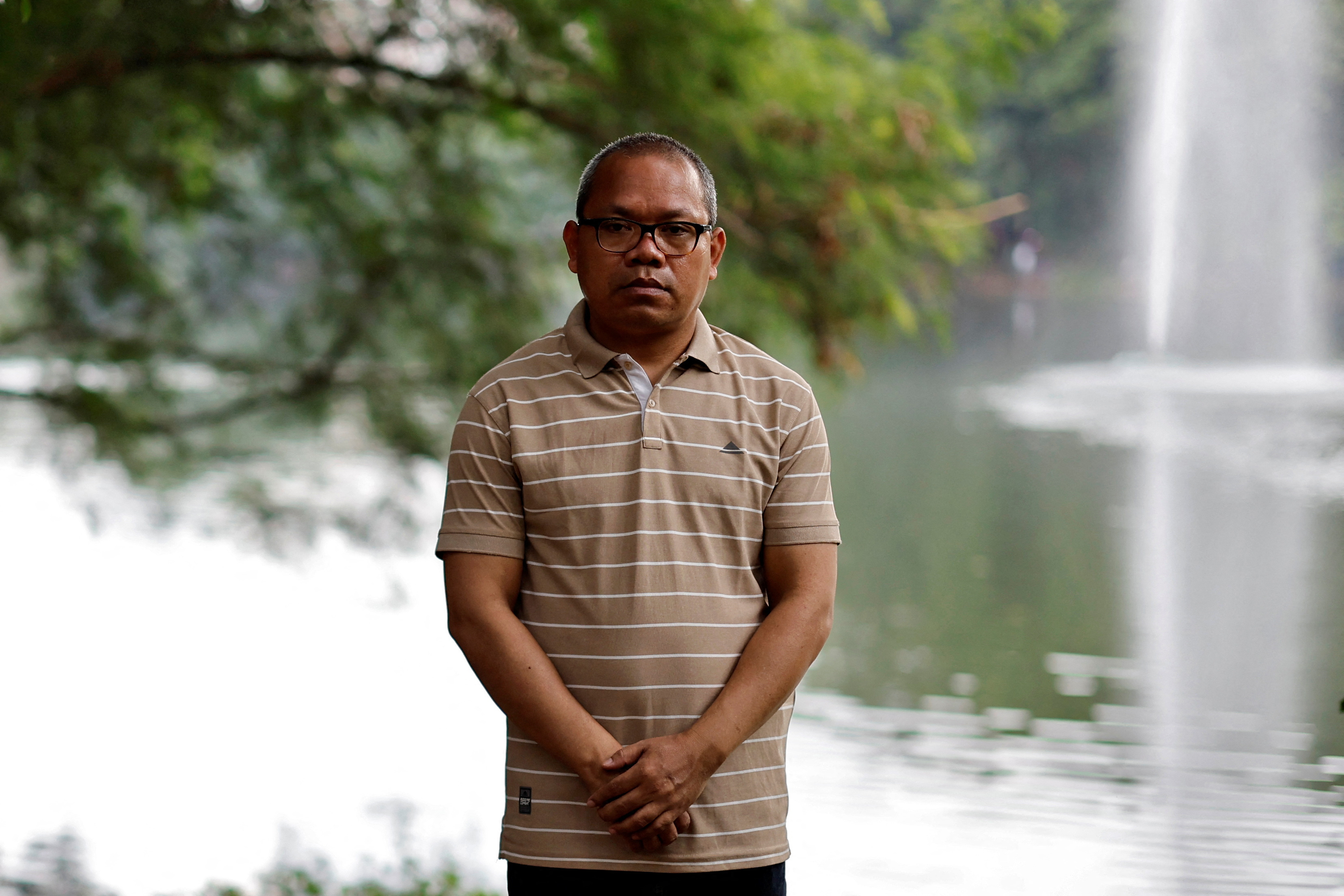 Indigenous people's rights activist Michael Chakma poses for a photograph at a park in Dhaka