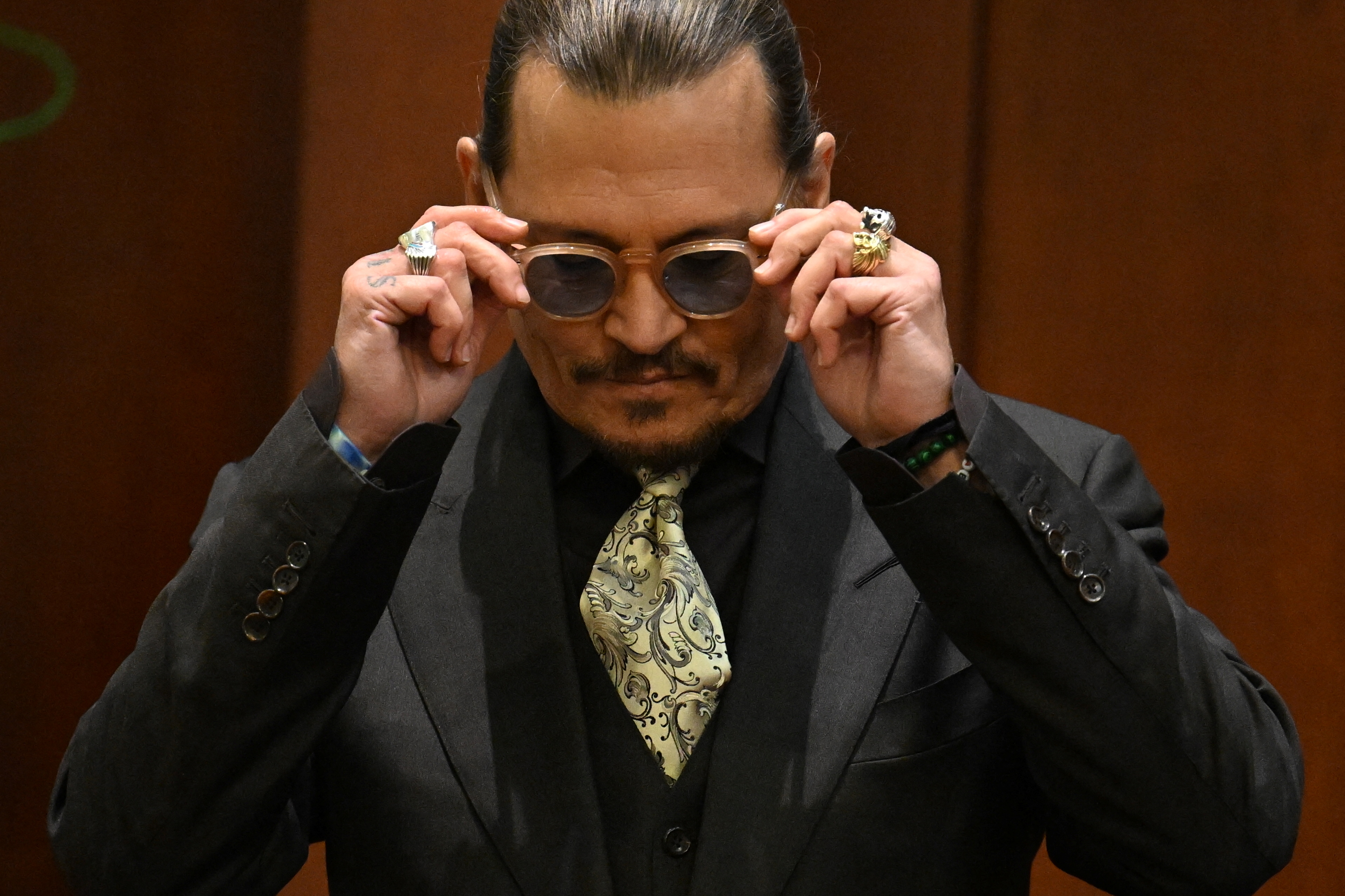 Johnny Depp calls Amber Heard accusations 'heinous,' says he never struck  ex-wife | Reuters