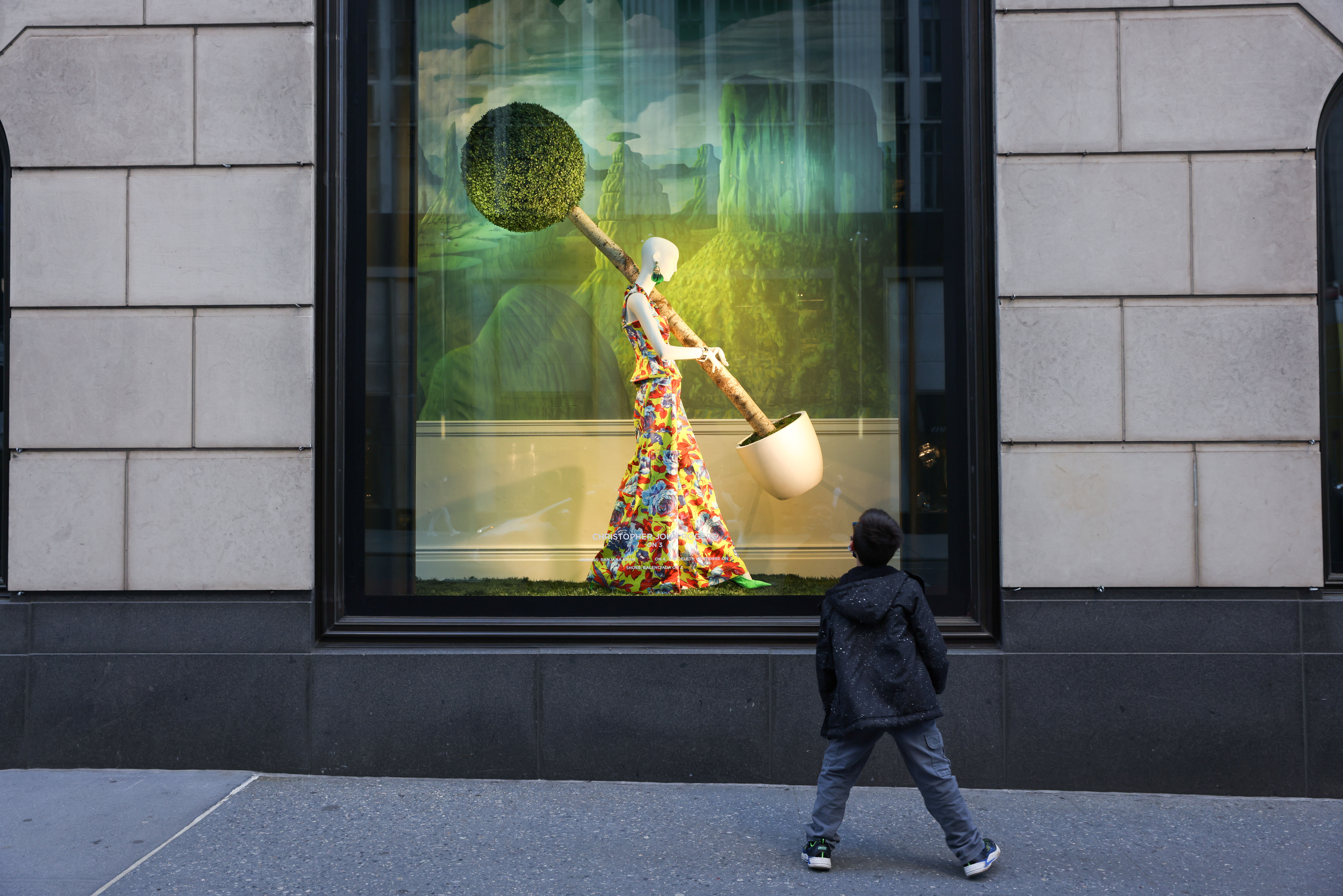 A child stops to look at a Bloomingdales display window in the Manhattan borough of New York City