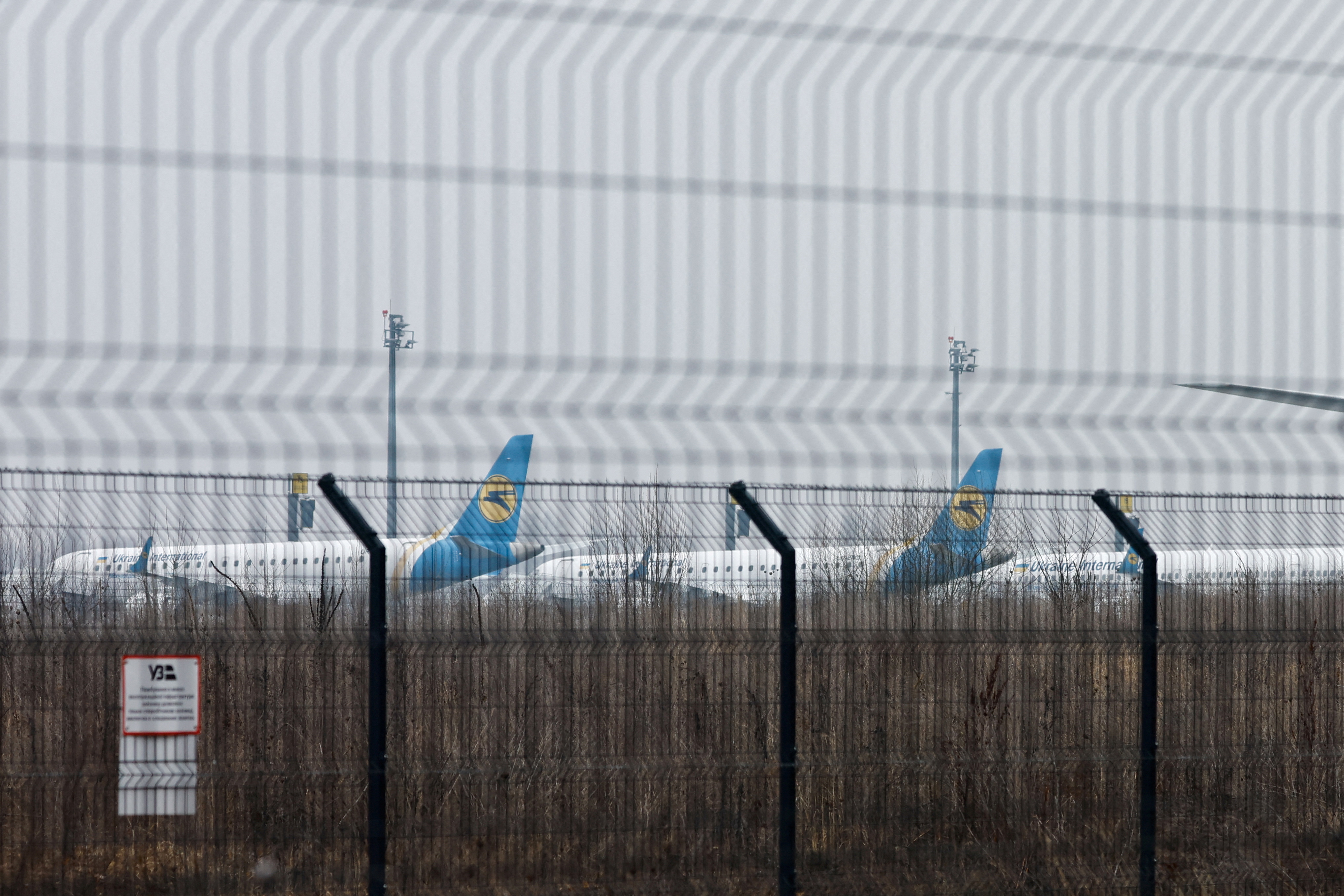 Parked planes are seen at Boryspil International Airport after Russia launched a massive military operation against Ukraine
