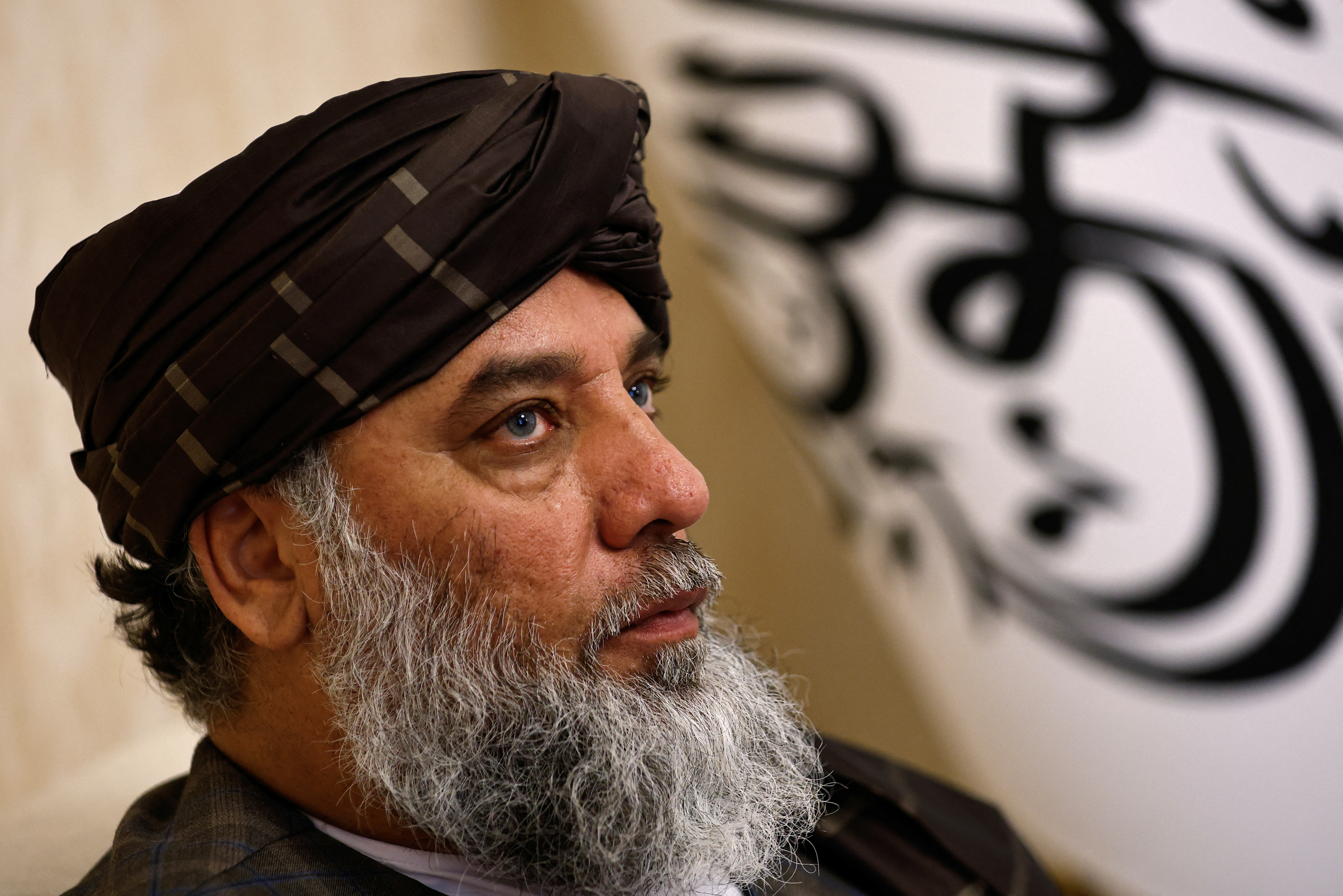 Taliban's acting commerce minister Haji Nooruddin Azizi speaks during an interview with Reuters, at the Embassy of Afghanistan in Beijing
