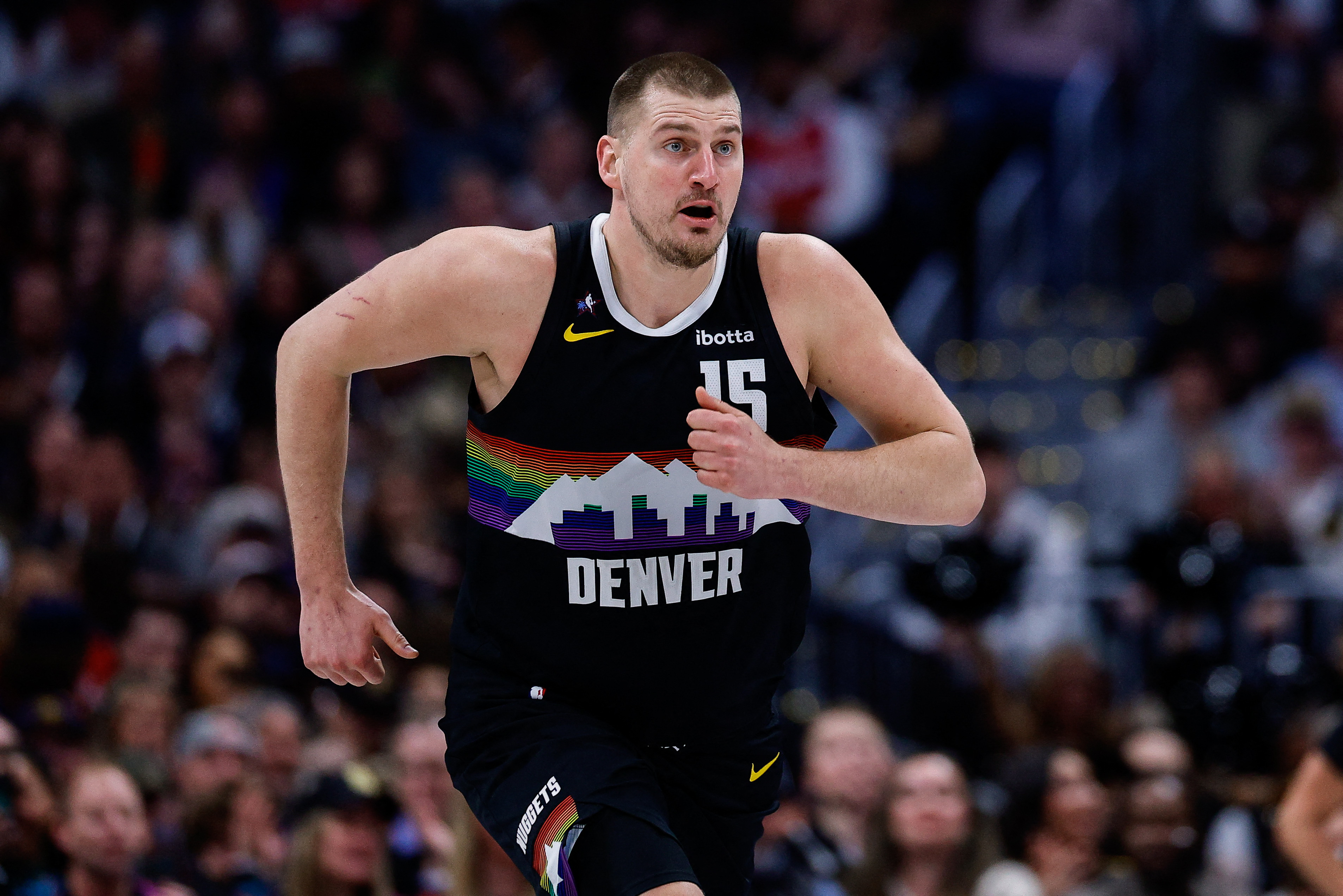 Nikola Jokic running in a Denver Nuggets jersey during 2026 action