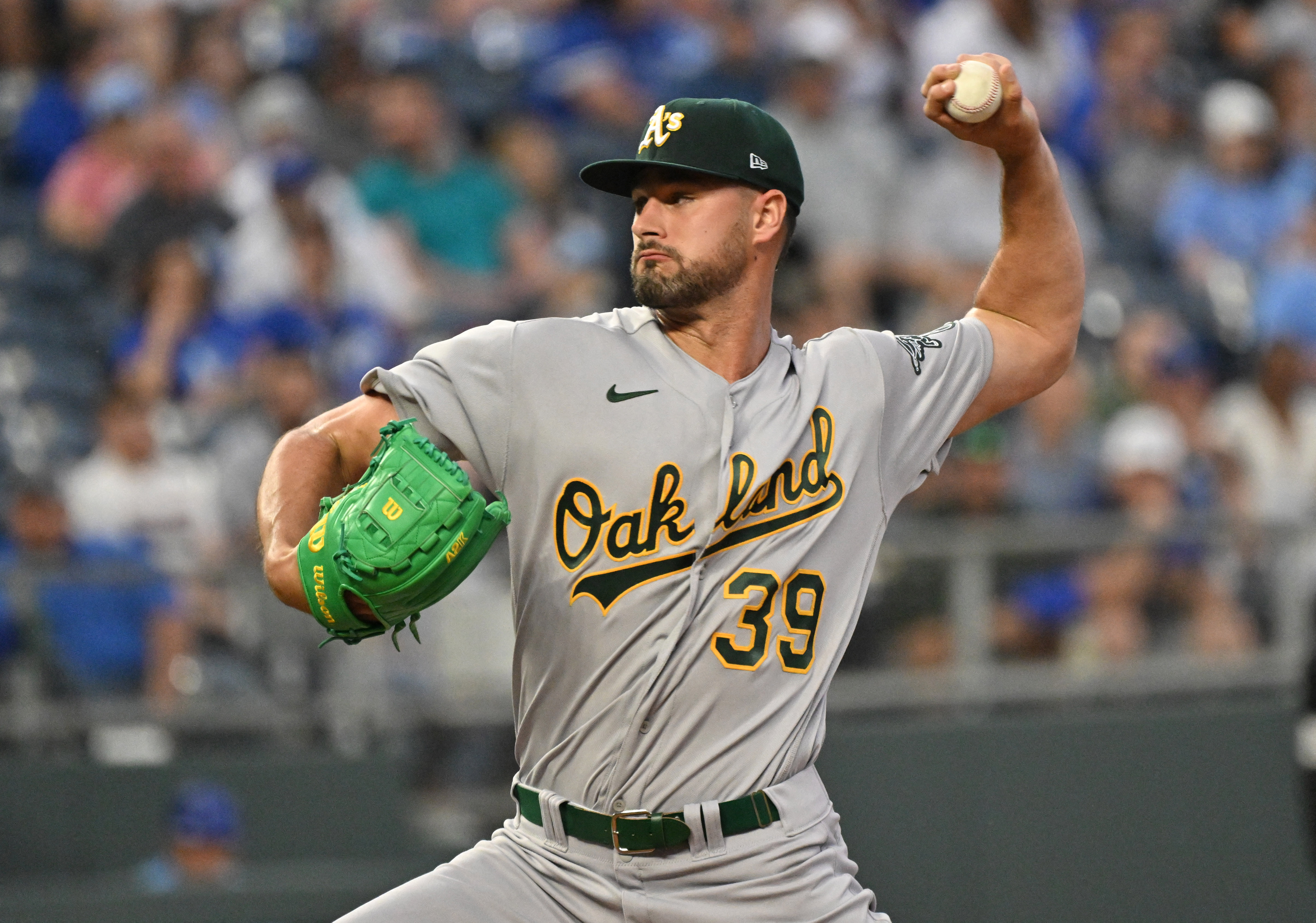 A's score big, hold off Royals' comeback bid