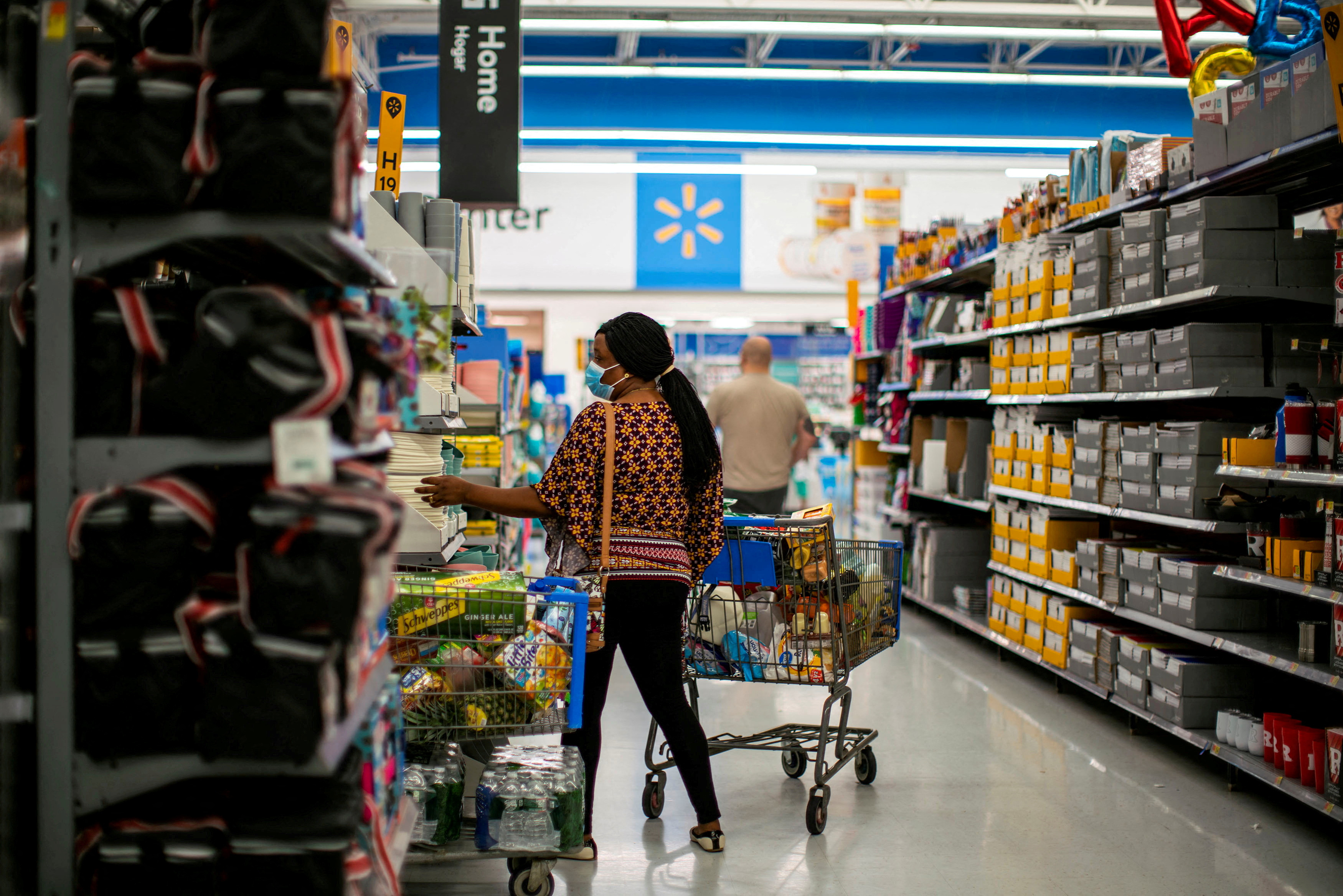 A shopper is seen wearing a mask while shopping at a Walmart store, in North Brunswick, New Jersey