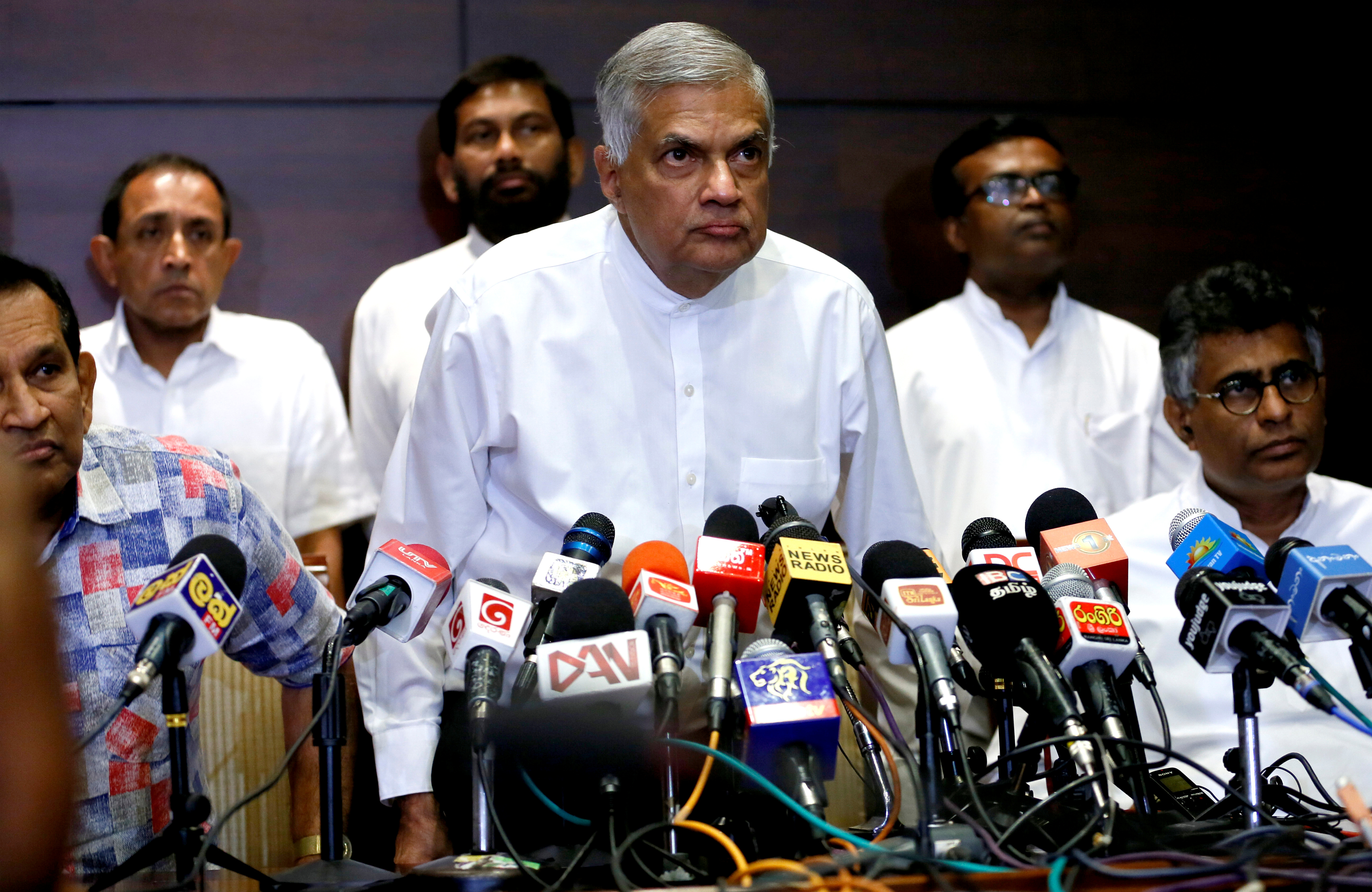 Sri Lanka's ousted Prime Minister Wickremesinghe arrives at a news conference in Colombo