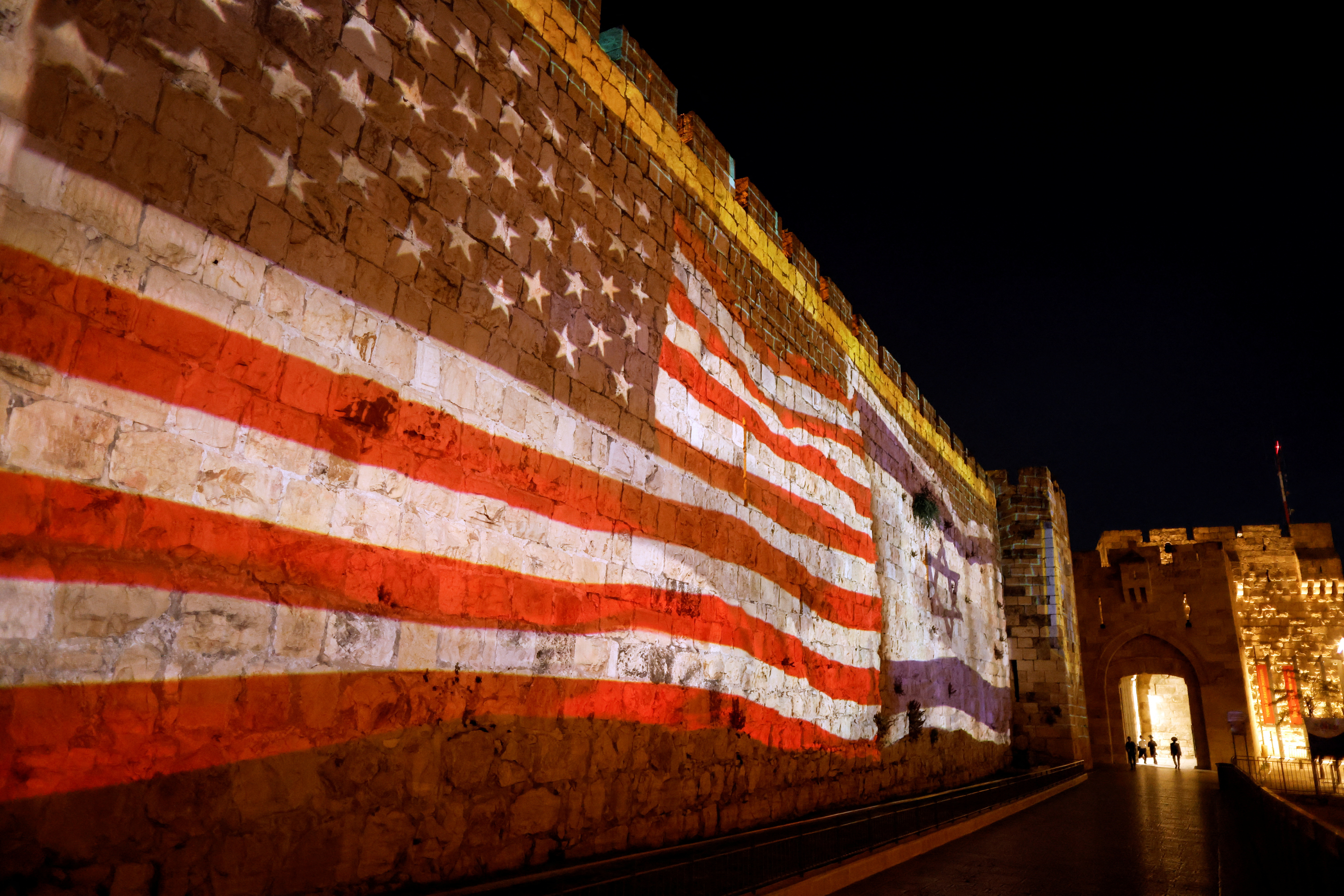 U.S. and Israeli national flags are projected on a part of the walls surrounding Jerusalem's Old City