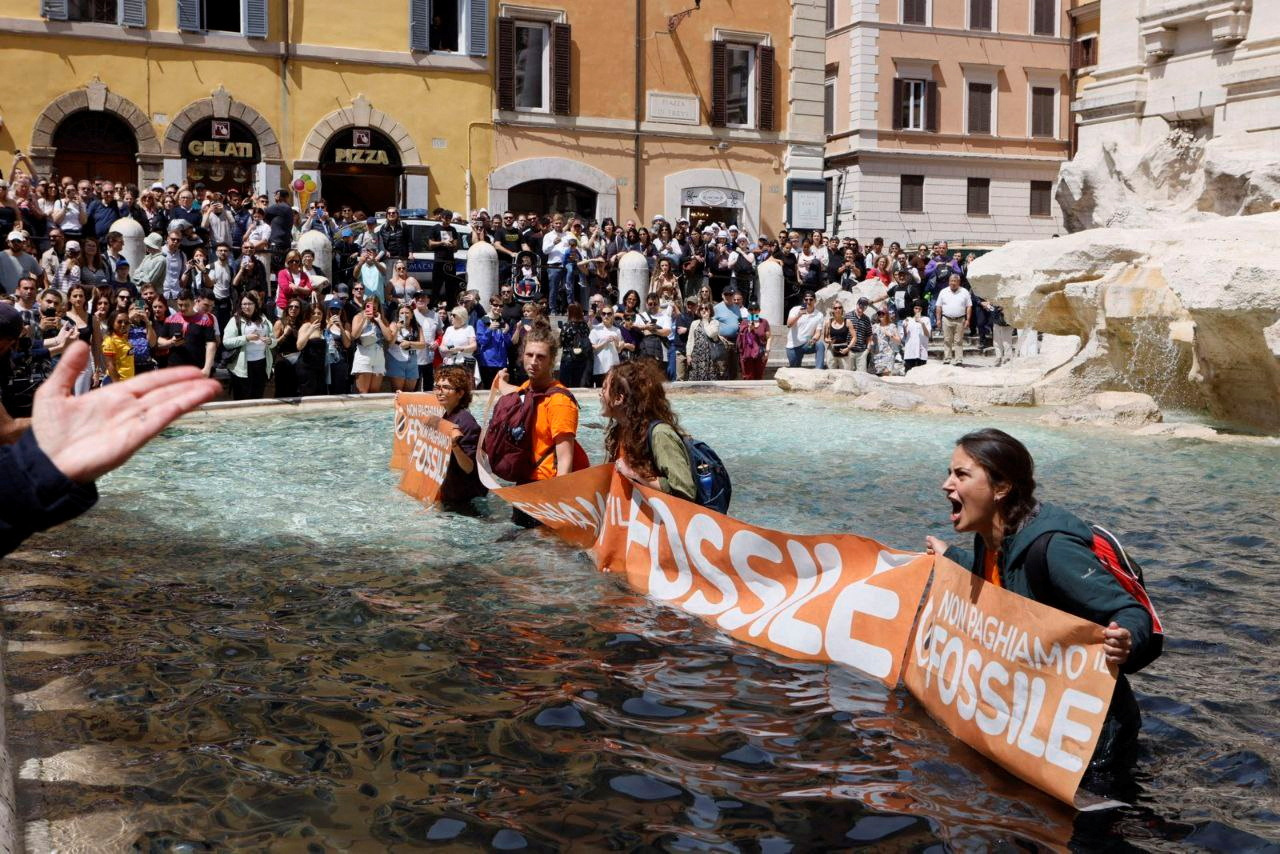 Trevi Fountain water turns black in Rome climate protest Reuters