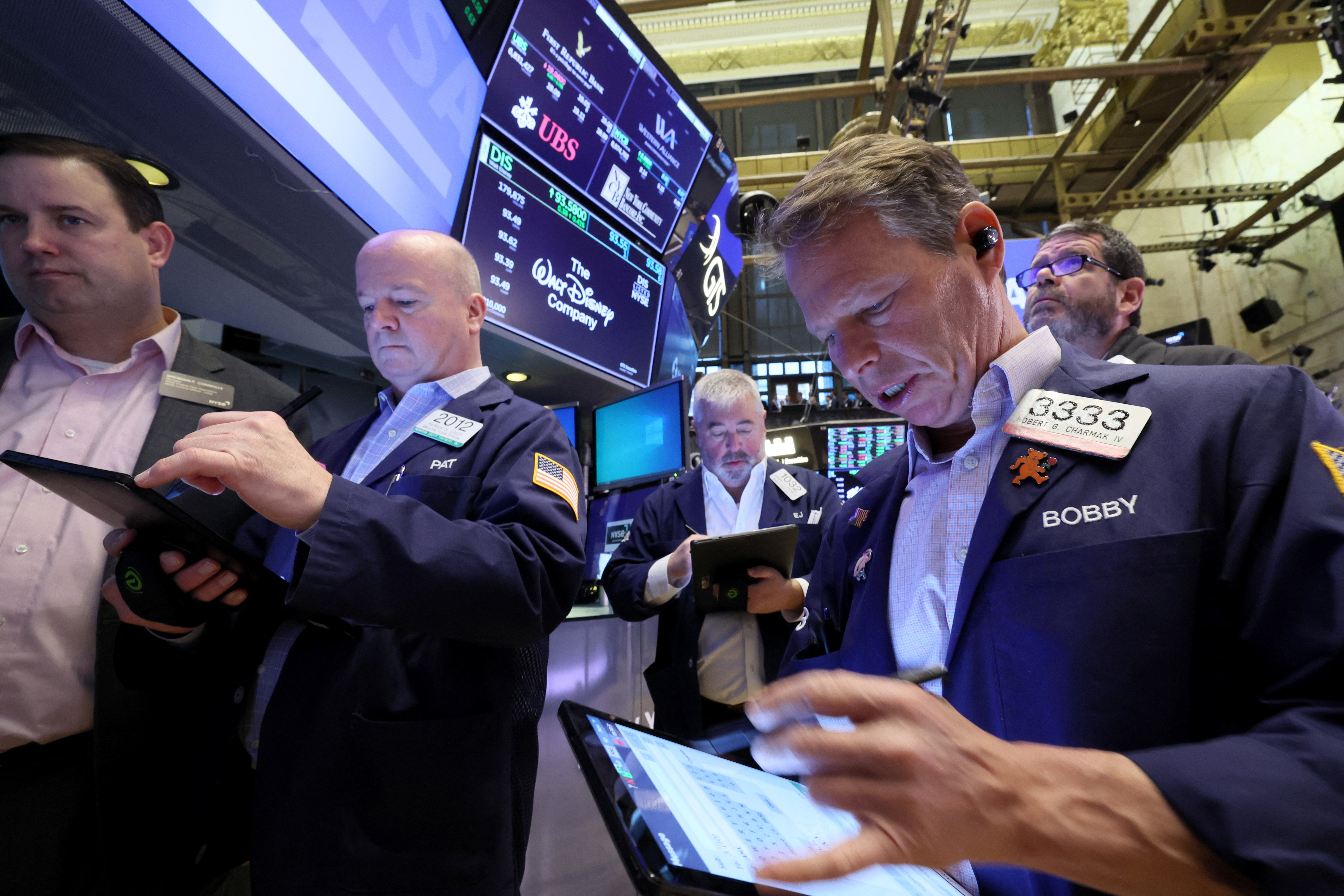 Traders work on the floor of the NYSE in New York