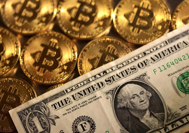 Illustration shows representations of cryptocurrency Bitcoin and U.S. dollar