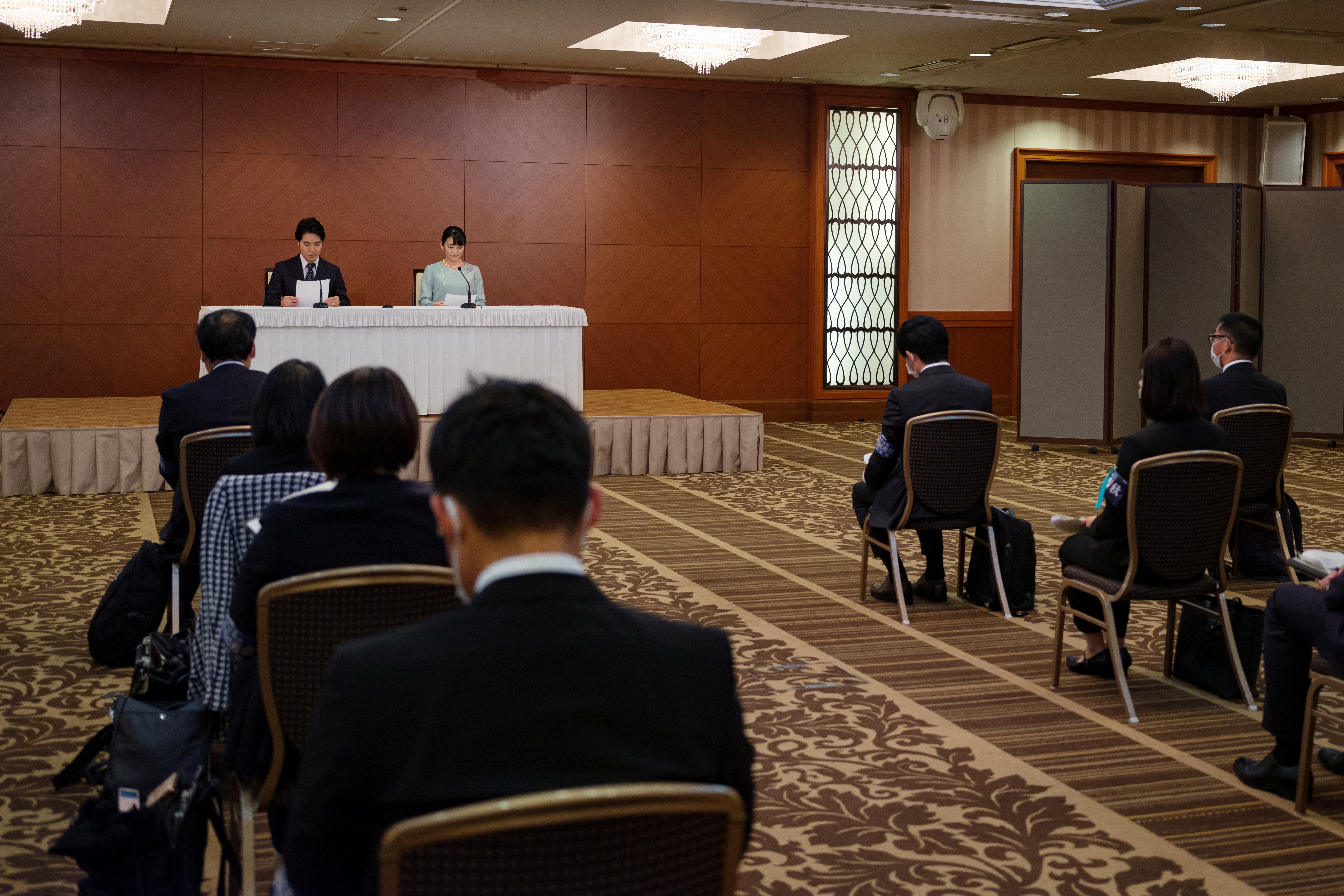 Japan's Princess Mako and her husband Kei Komuro attend a news conference to announce their marriage registration at Grand Arc Hotel in Tokyo, Japan, October 26, 2021. Nicolas Datiche/Pool via REUTERS