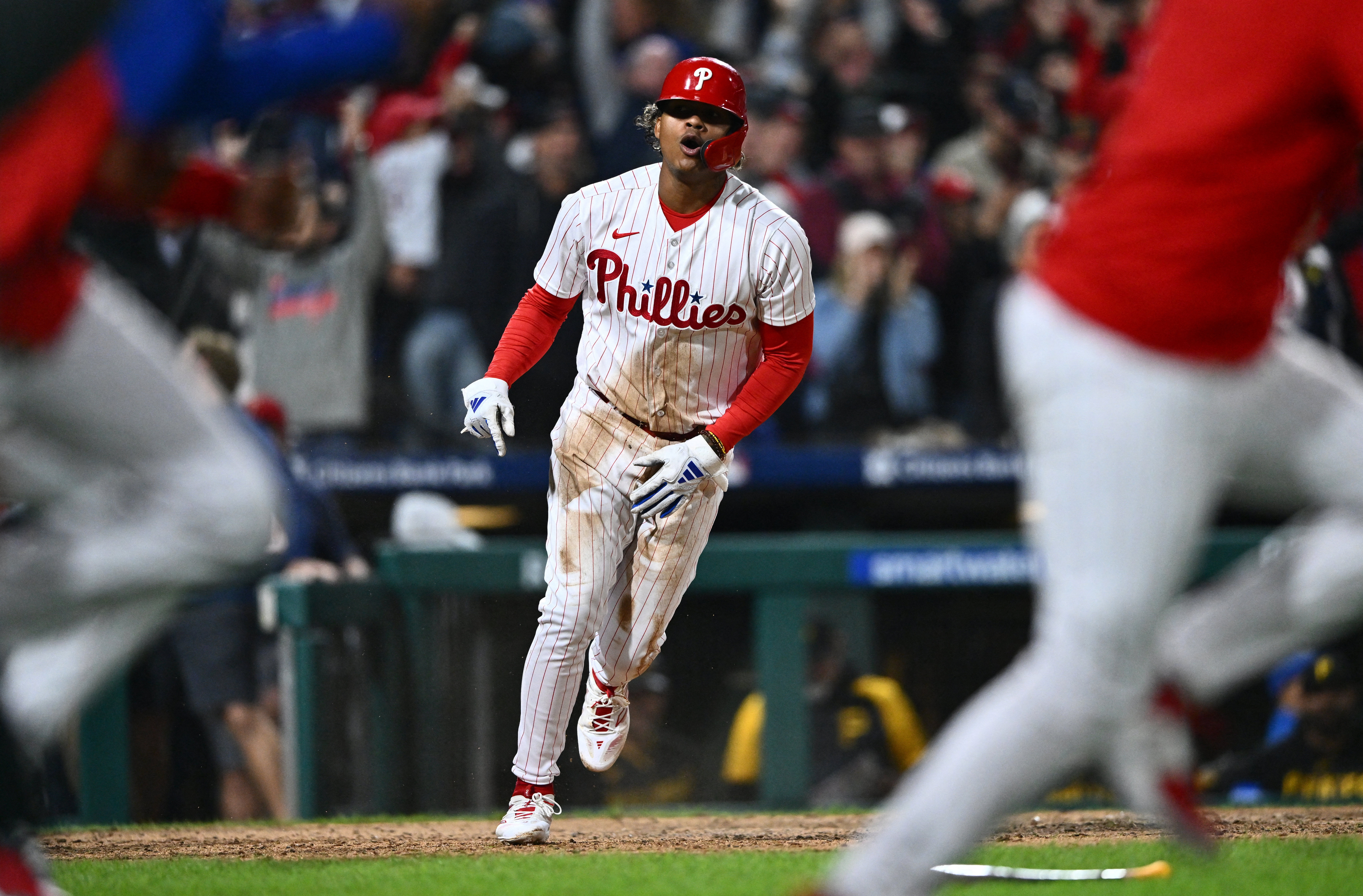 Phillies win in 10 to punch playoff ticket, Sports