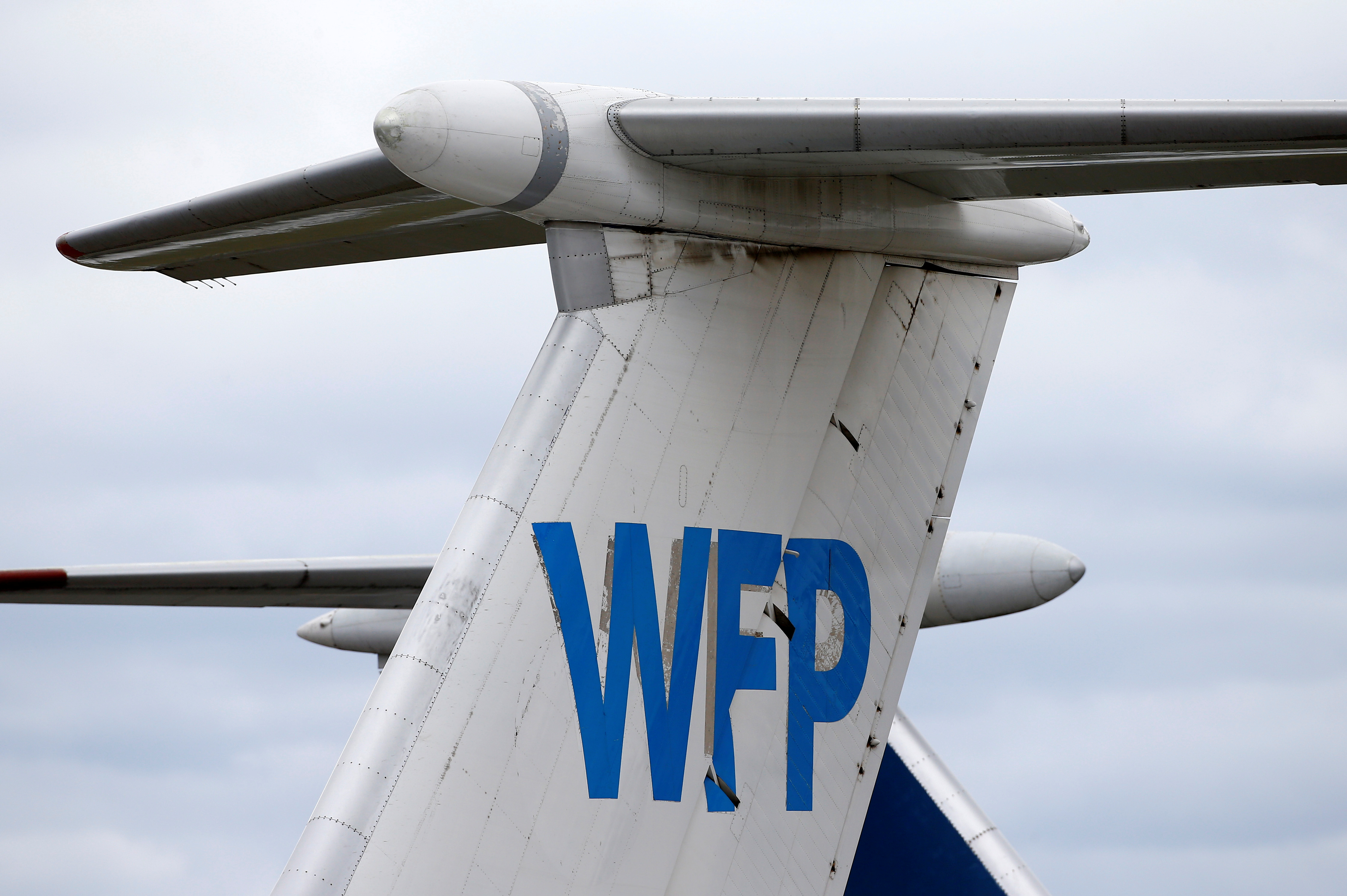 Logo of the World Food Programme humanitarian organization is seen on a plane at the National Airport Minsk