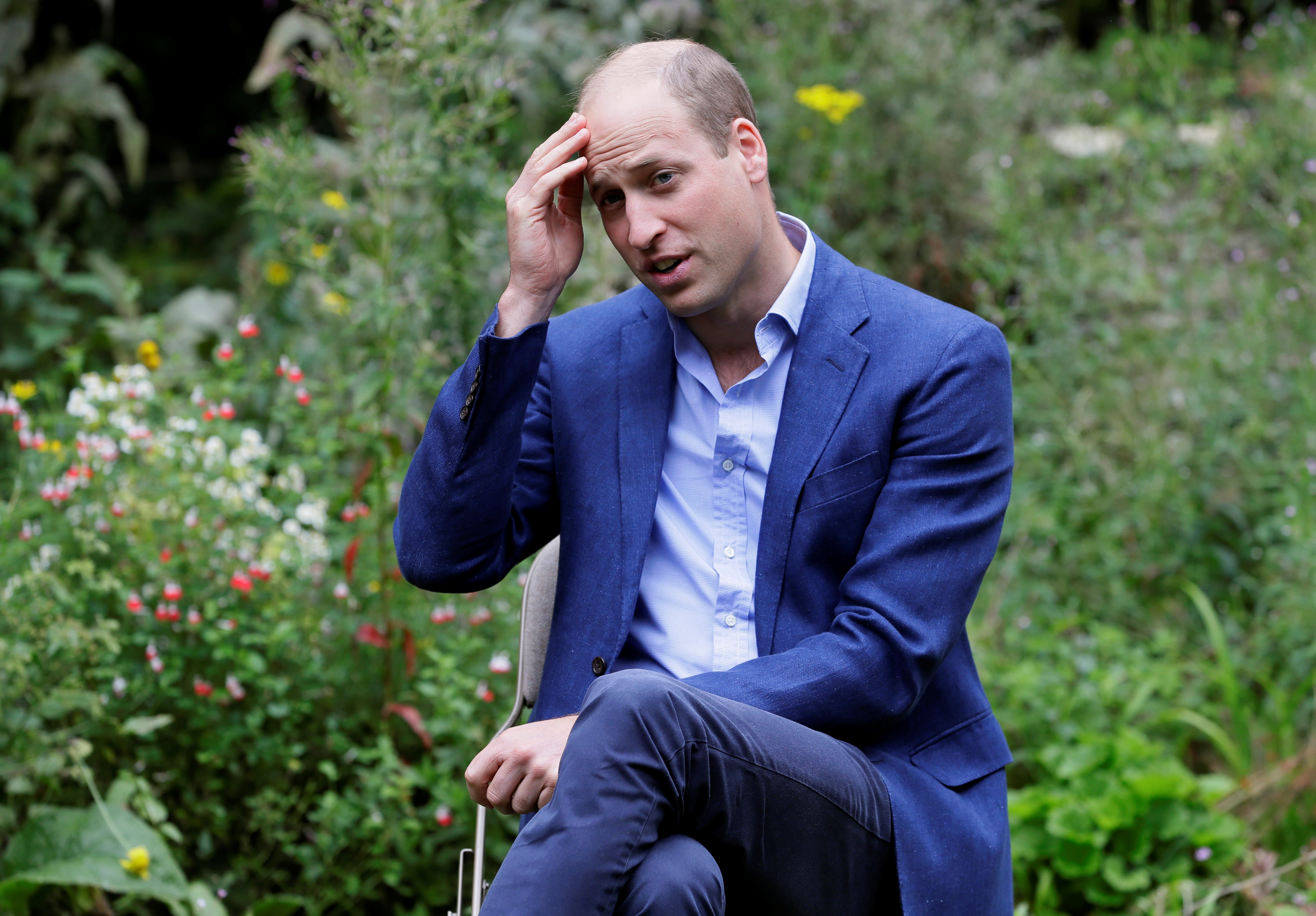 Britain's Prince William, Duke of Cambridge, speaks during a visit to the Garden House, part of the Light Project, which works on getting people safely off the streets throughout the coronavirus disease (COVID-19) outbreak, in Peterborough, Britain, July 16, 2020. Kirsty Wigglesworth/Pool via REUTERS