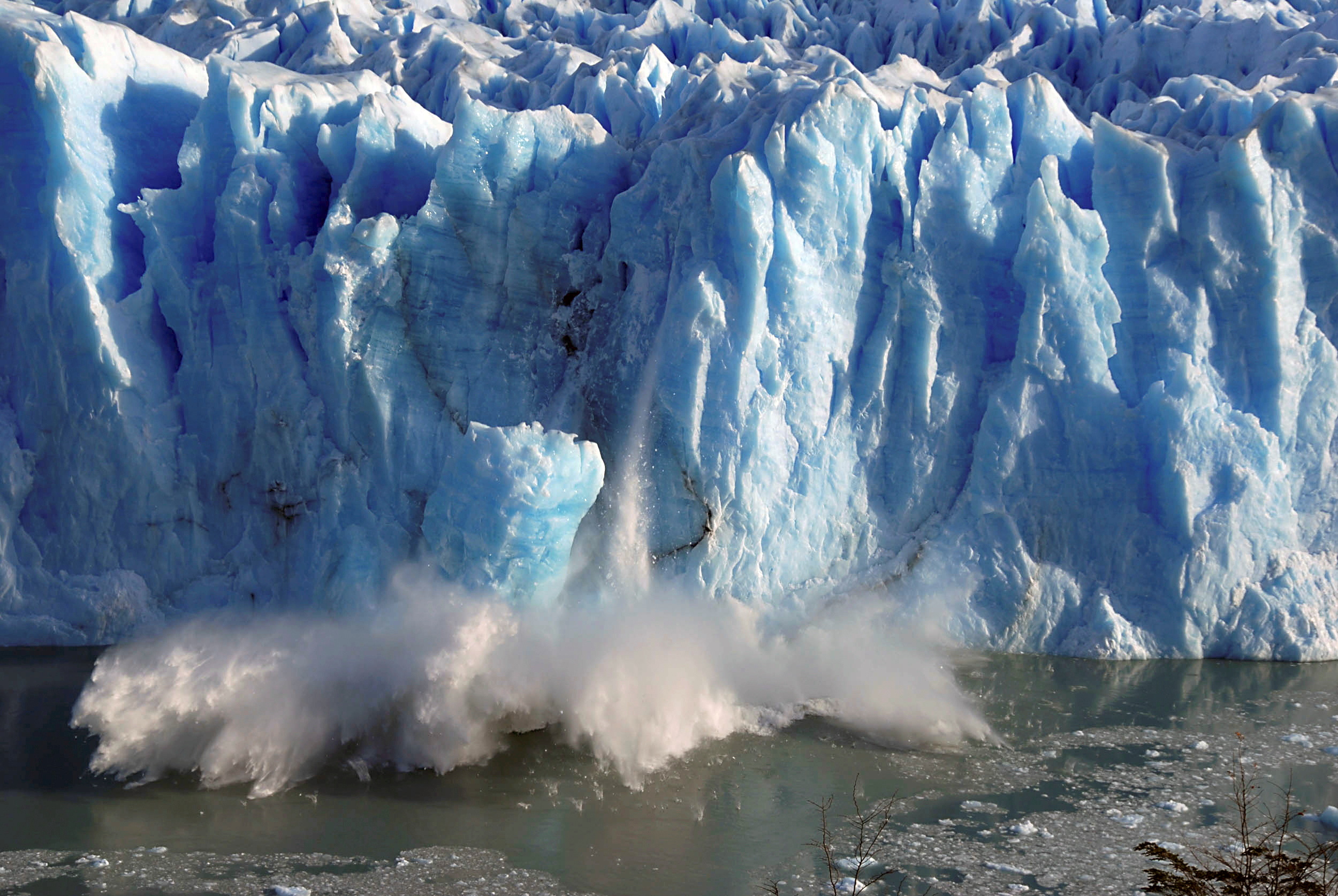Splinters of ice peel off from one of the sides of the Perito Moreno glacier