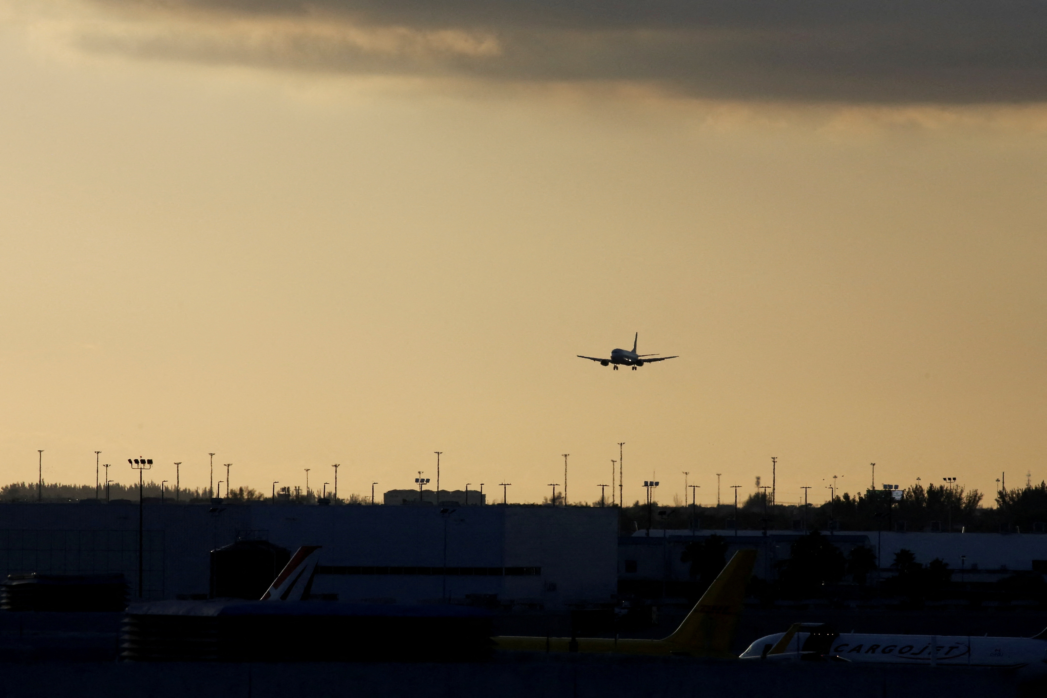 A plane prepares to land at Miami International Airport
