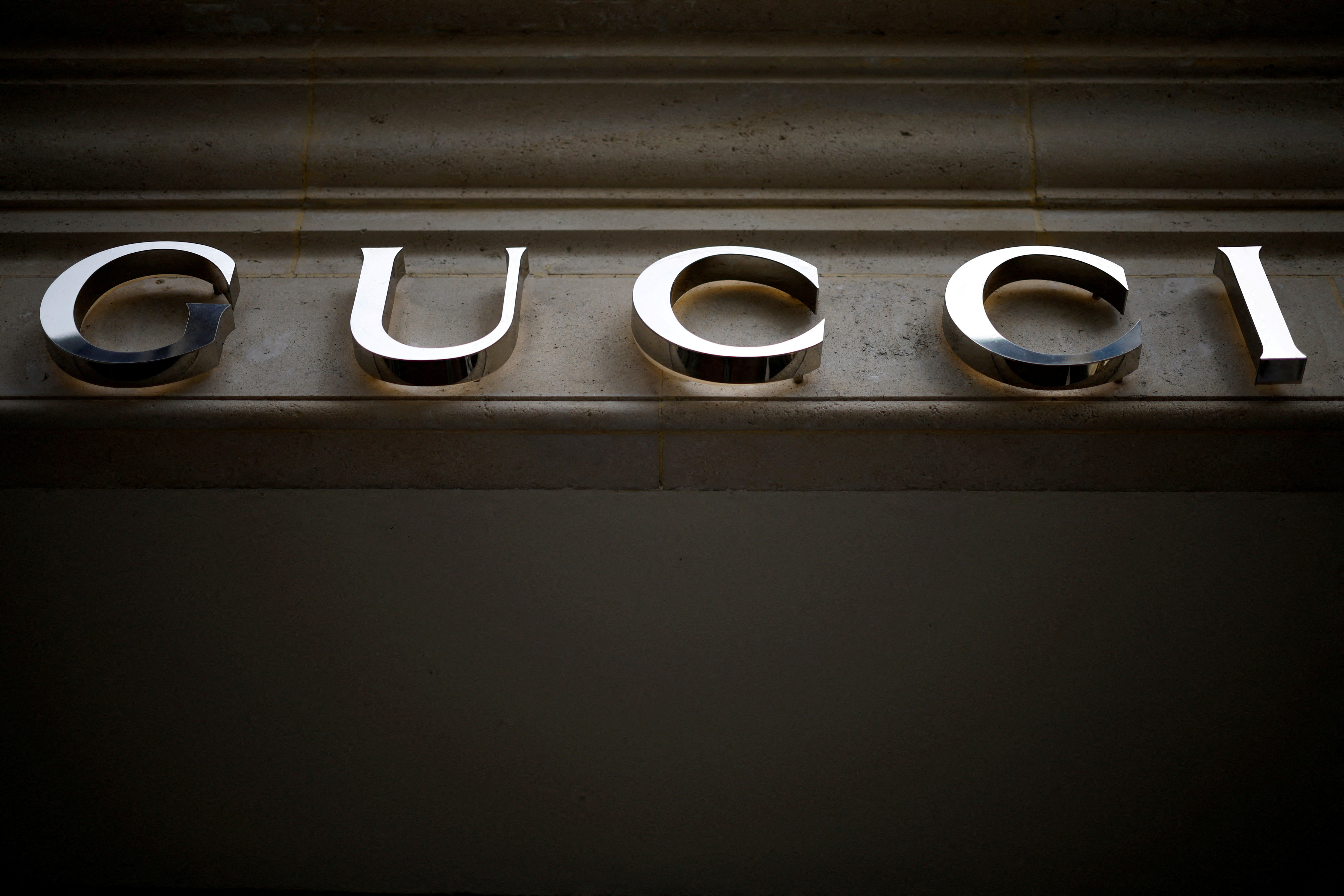 A Gucci logo is seen outside a shop in Paris