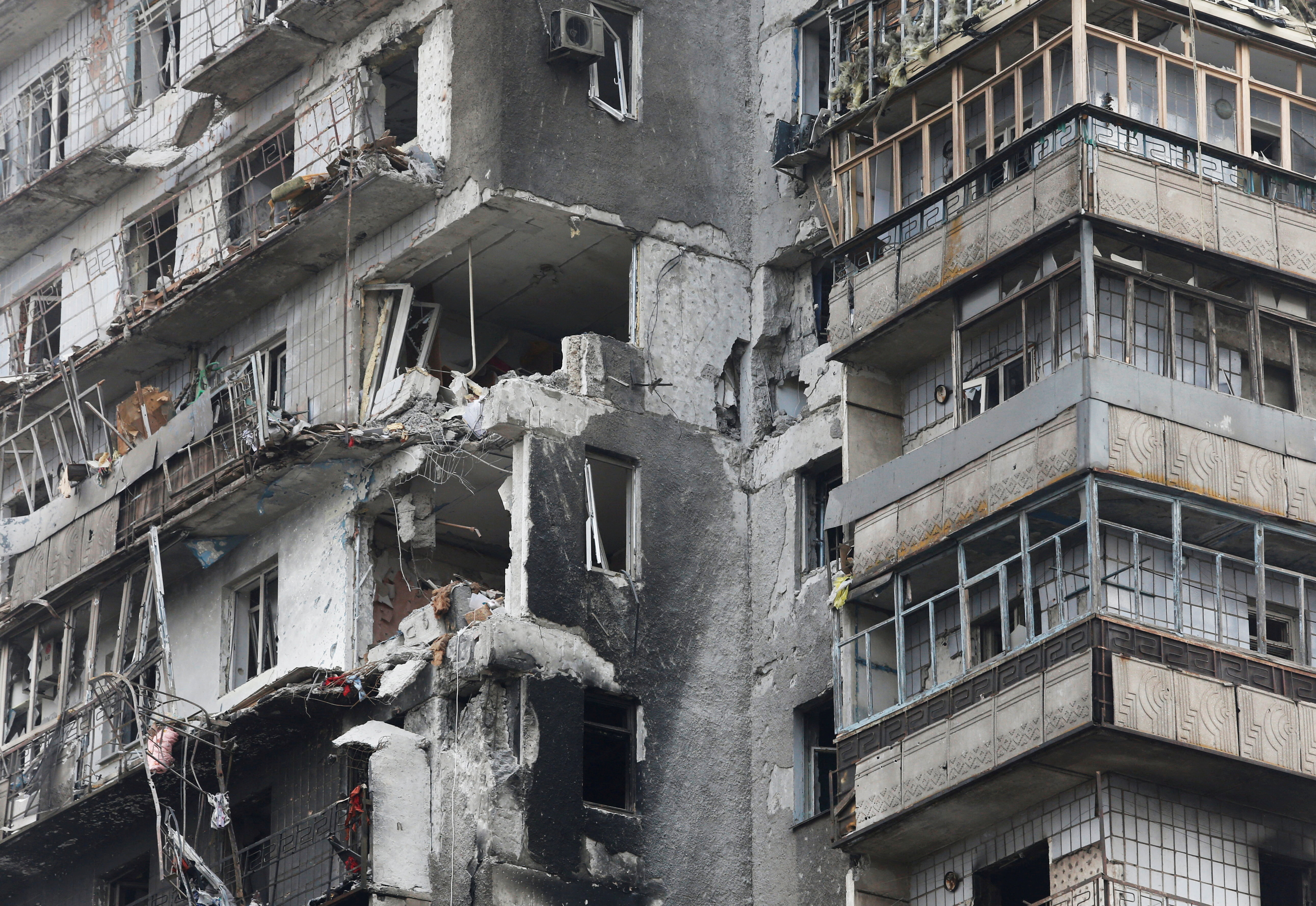 A view shows a damaged residential building in the besieged city of Mariupol