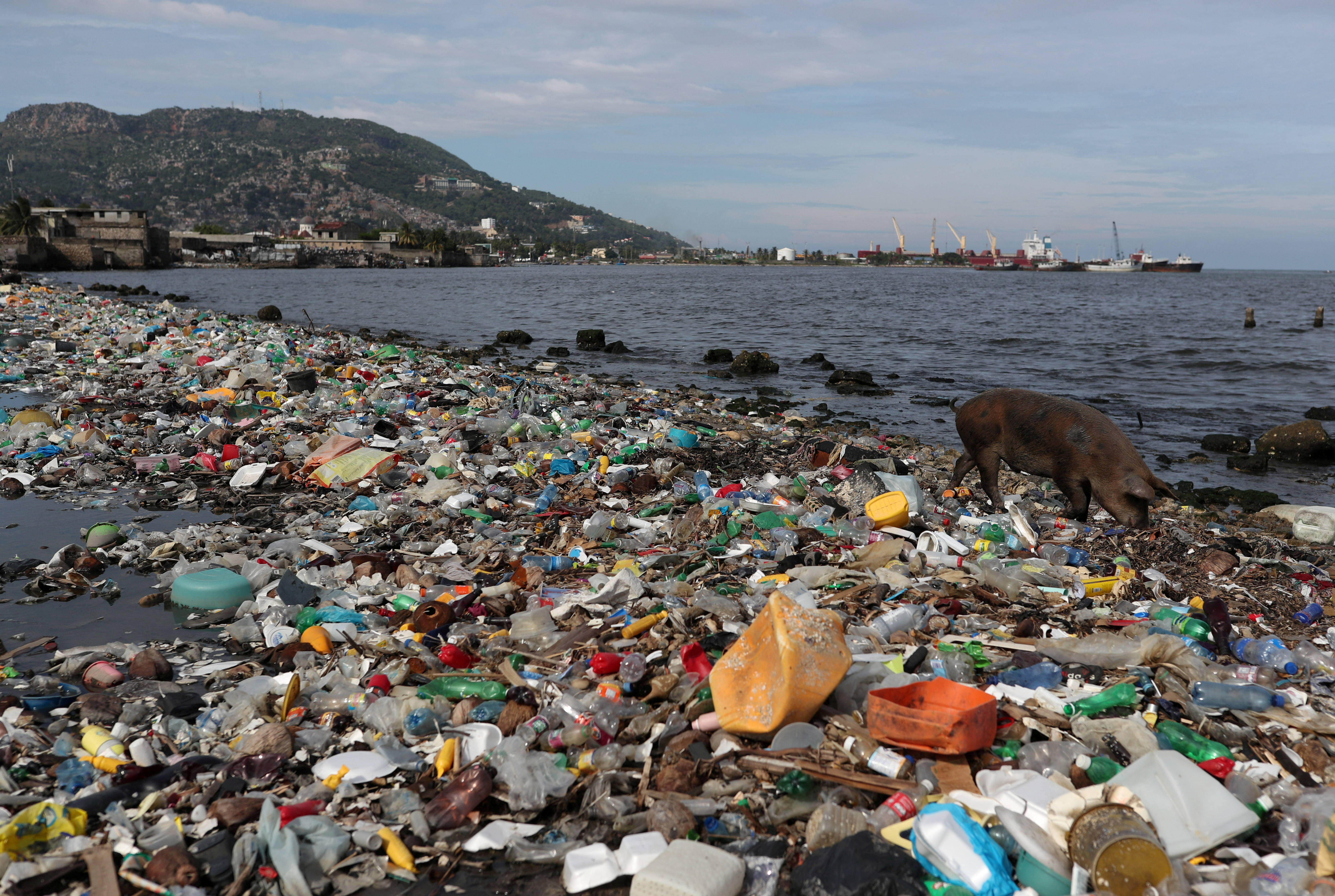 Plastic and other debris are seen on the shores of Cap Haitian beach, in Cap Haitian