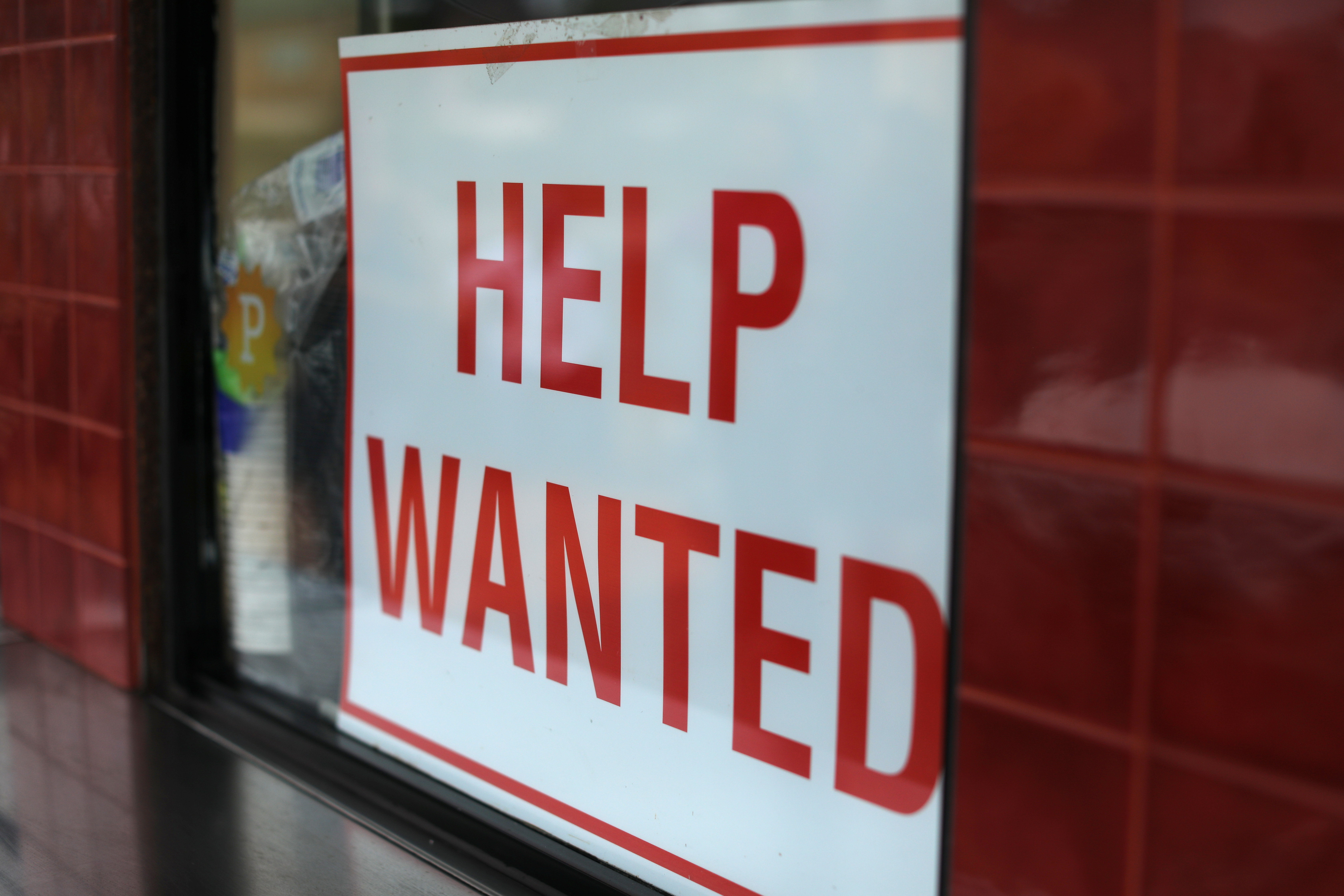 Help Wanted sign at taco stand in California