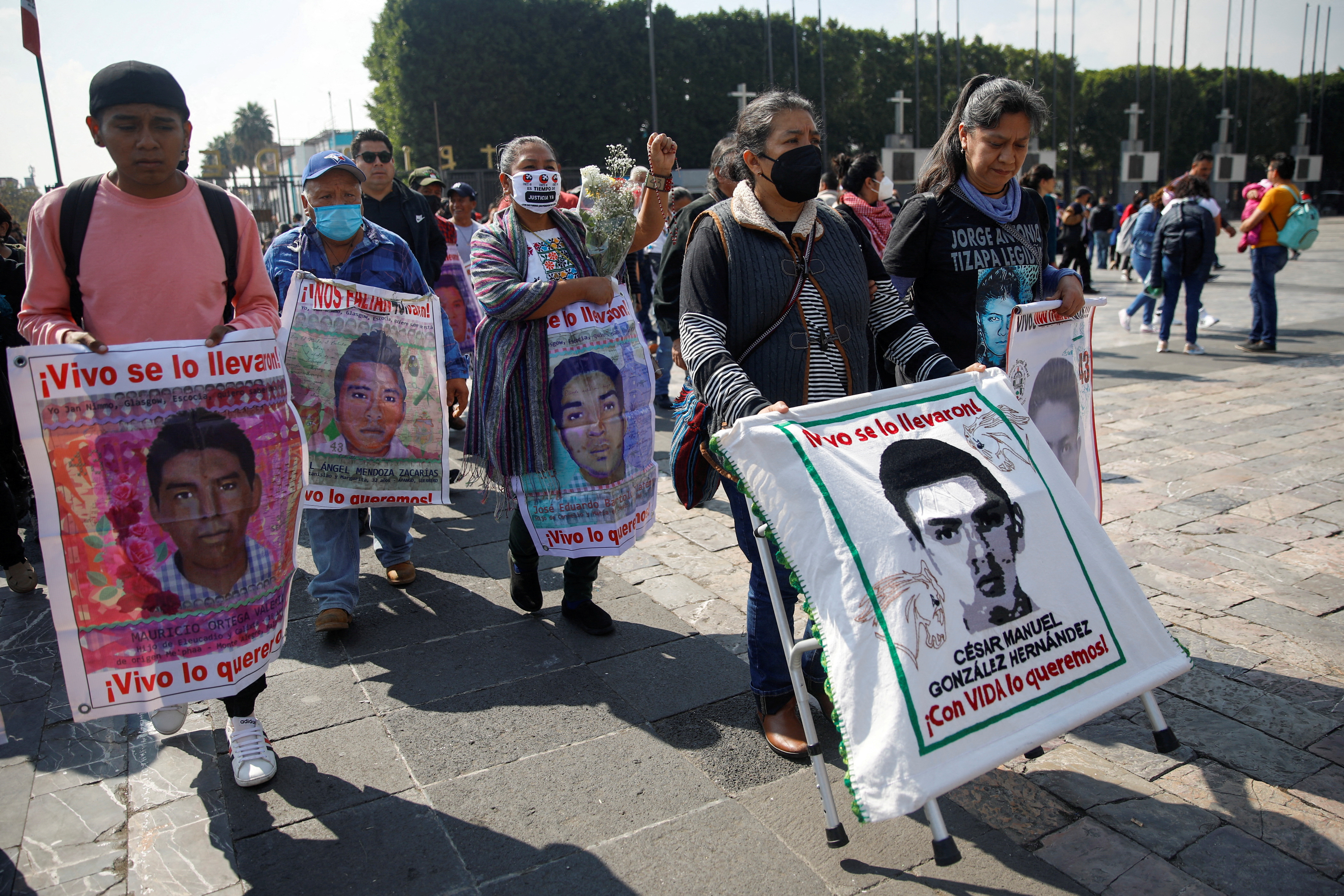 People march towards the Basilica of Our Lady of Guadalupe to mark the disappearance of the 43 students of Ayotzinapa in Mexico City