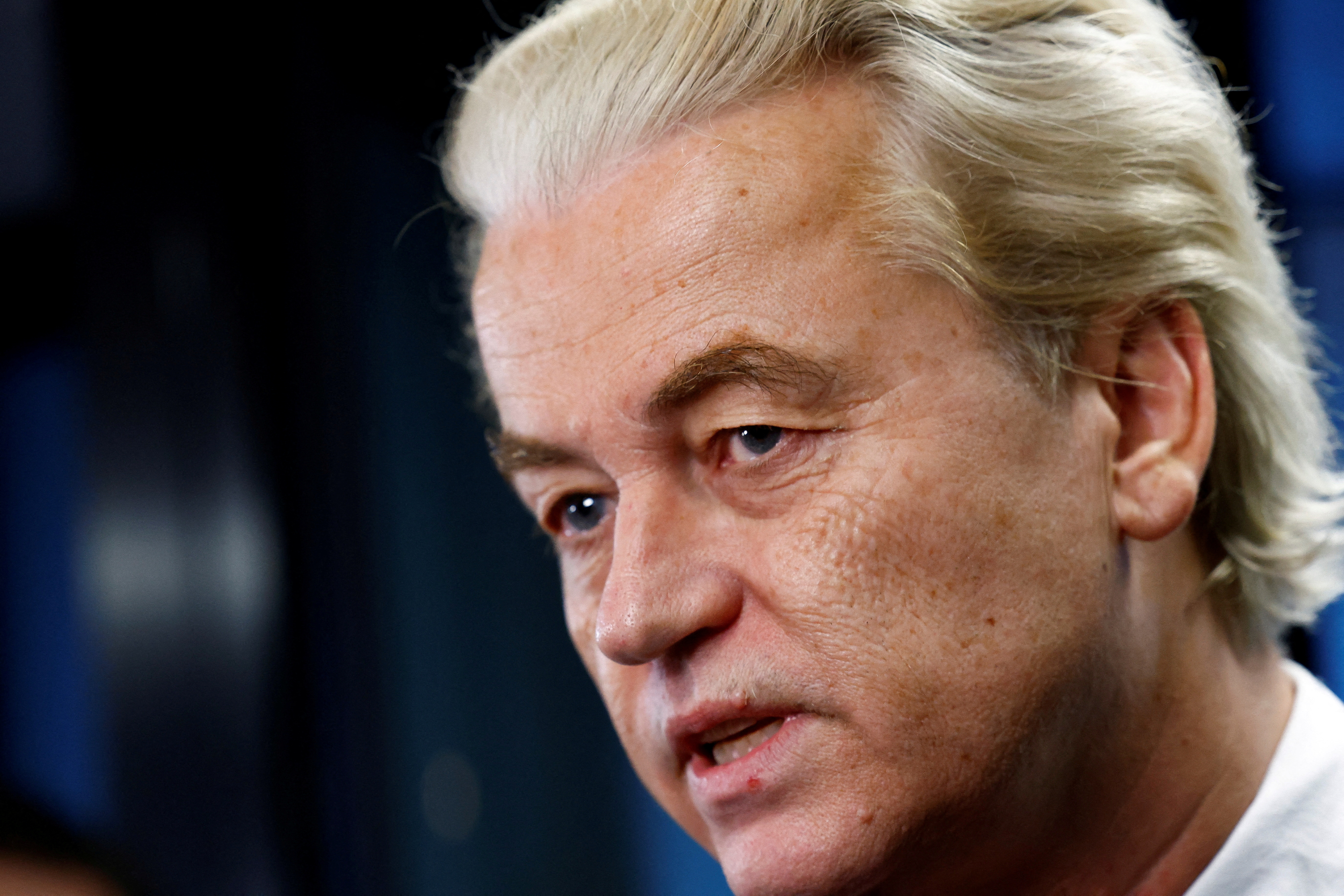 Dutch far-right politician and leader of the PVV party Geert Wilders reacts as he meets the press