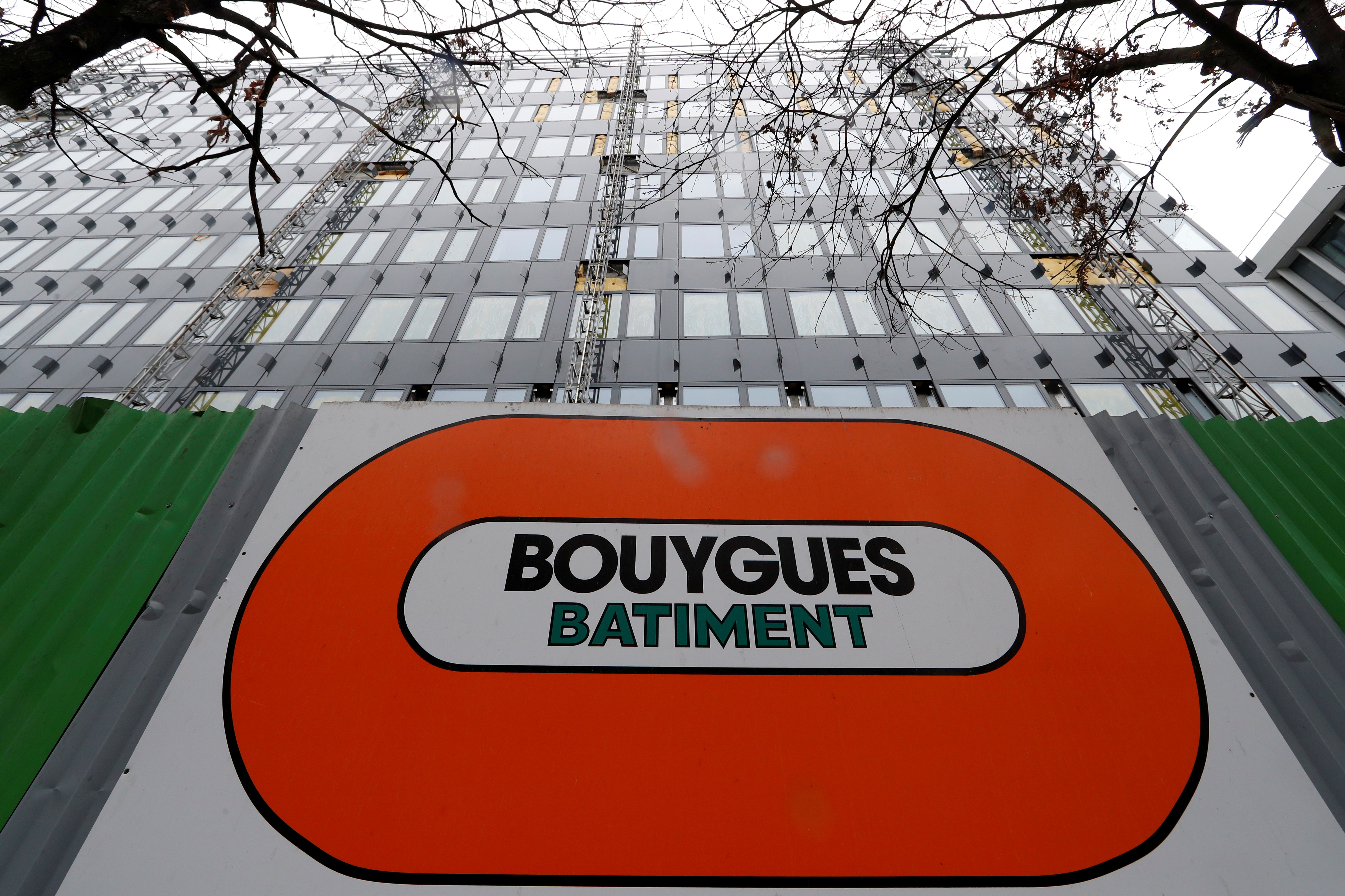 A Bouygues company logo is seen on a construction building site in Paris