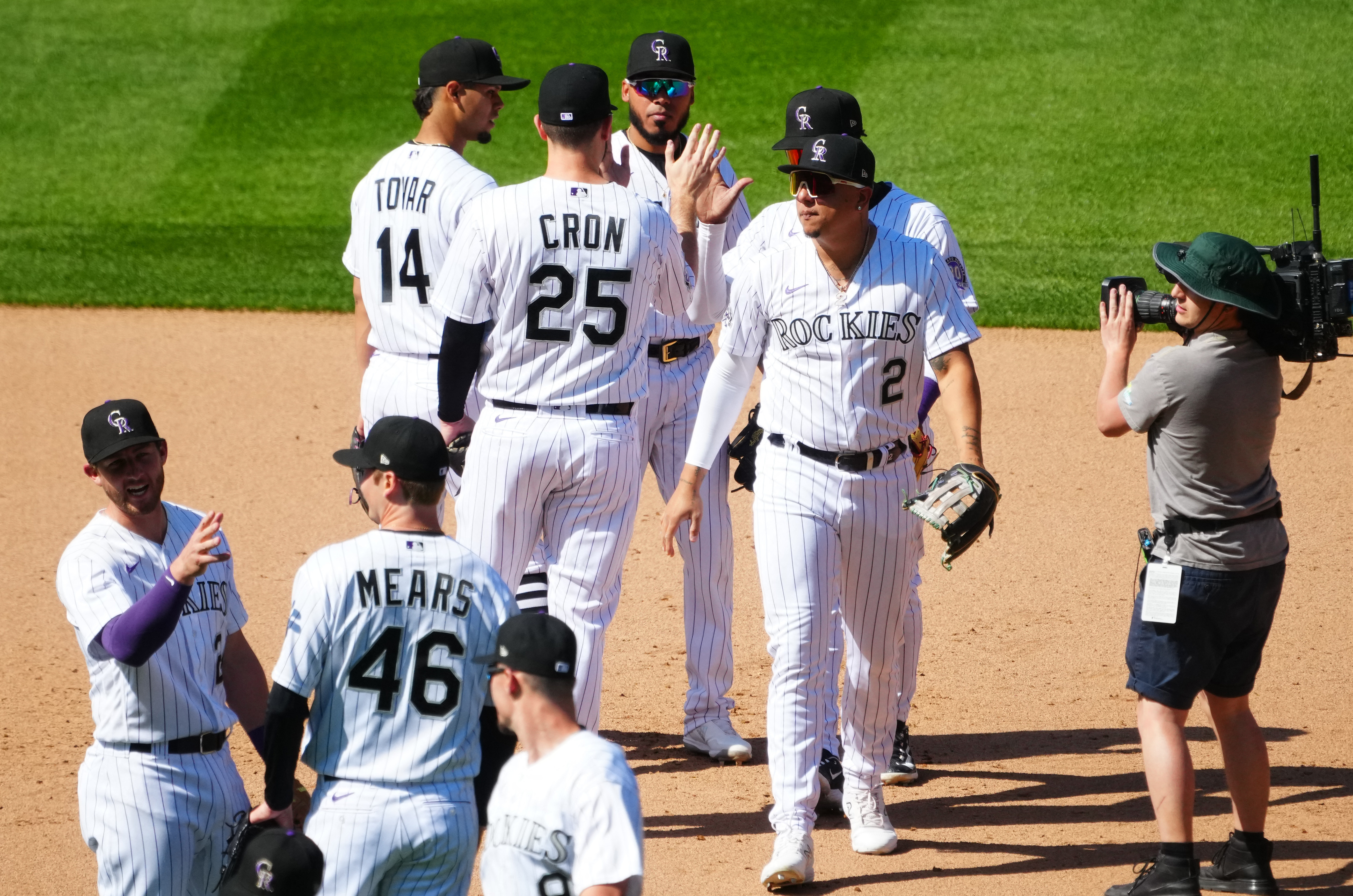 Rockies offense explodes in 12-4 win to avoid sweep