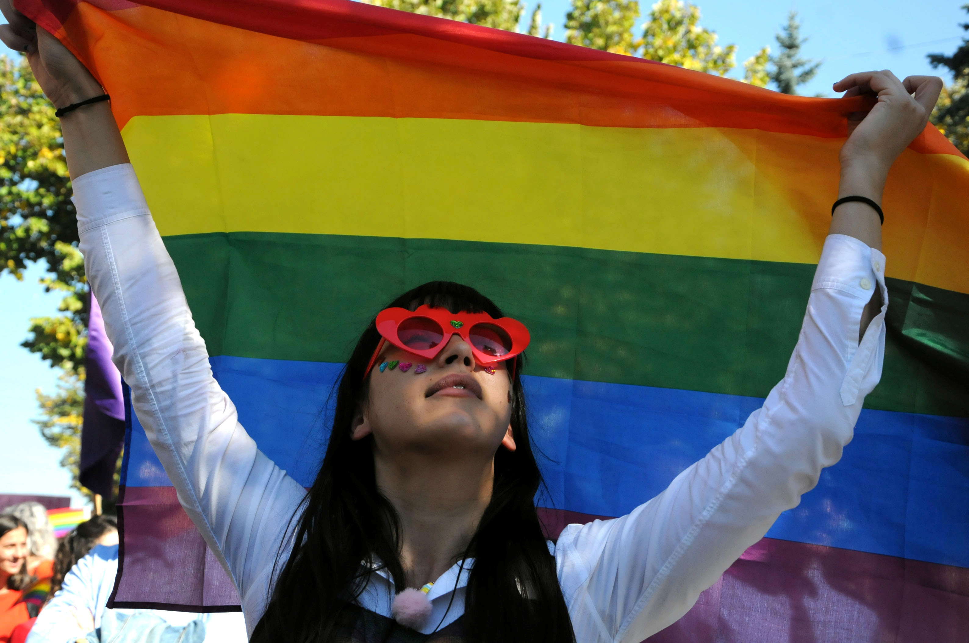 A woman takes part in the LGBT Pride Parade in Pristina