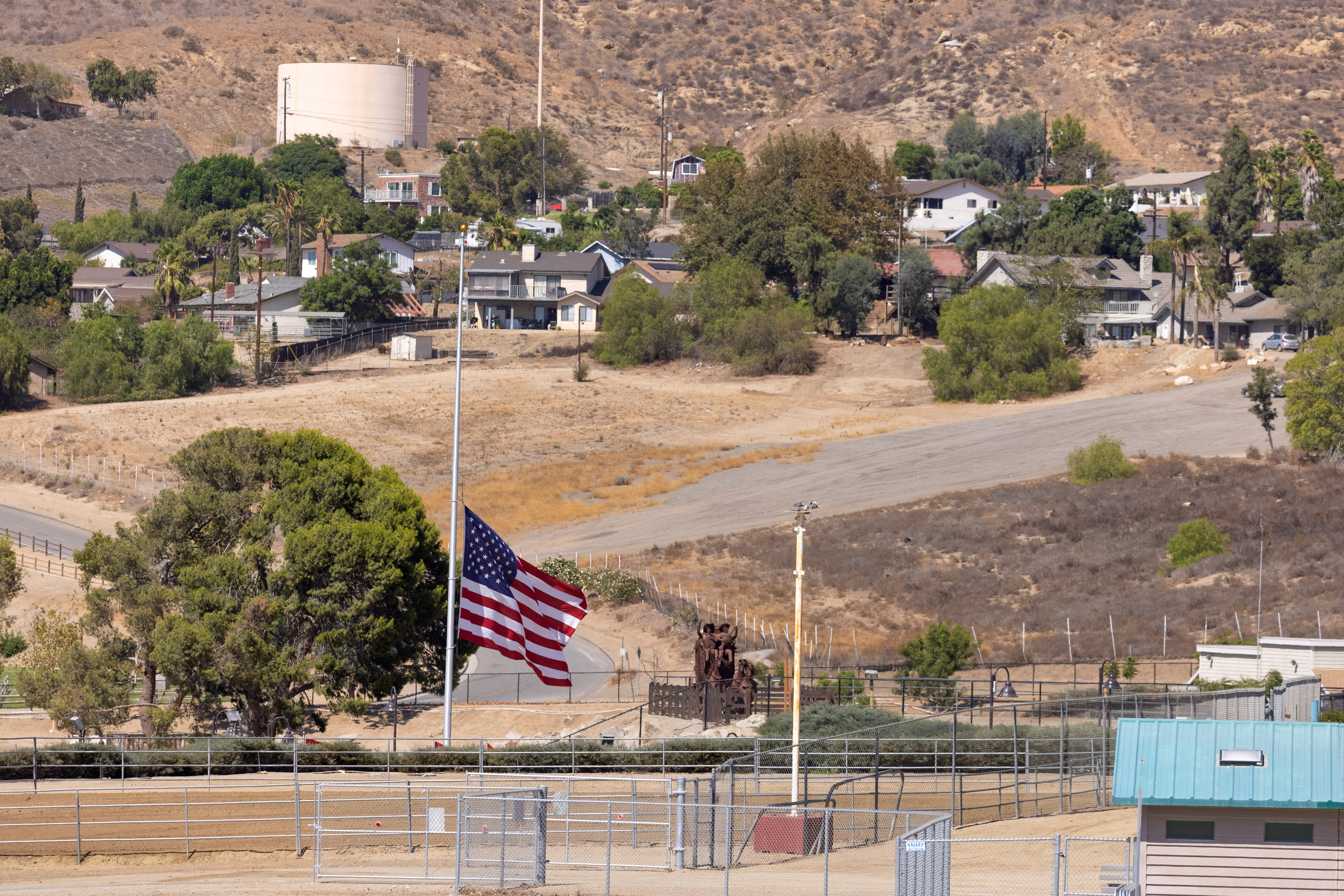 The American flag flies at half-mast in the home town of Marine Corps Lance Corporal Kareem Nikoui in Norco