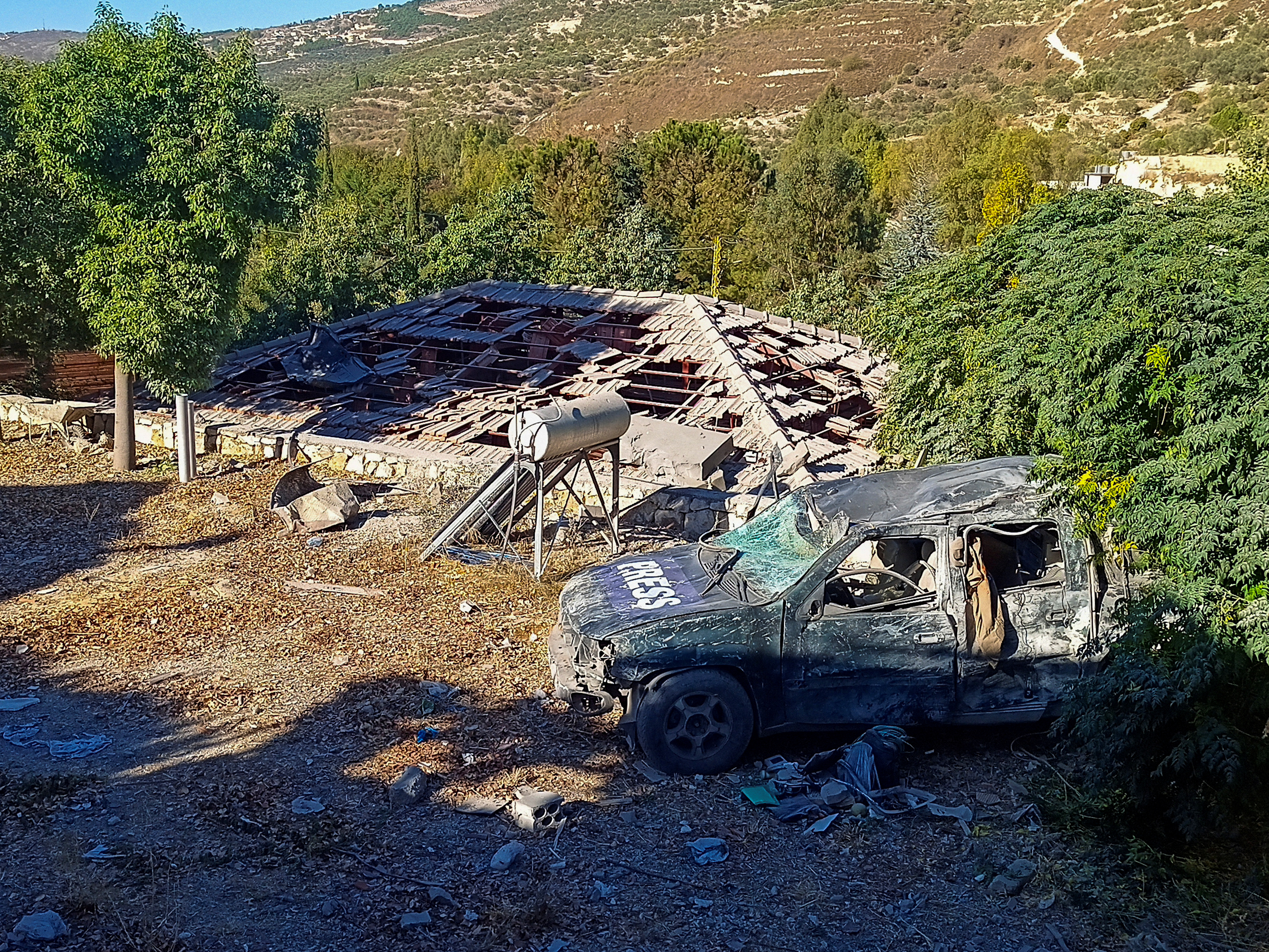 Damaged Press vehicle at the site of an Israeli strike in Hasbaya