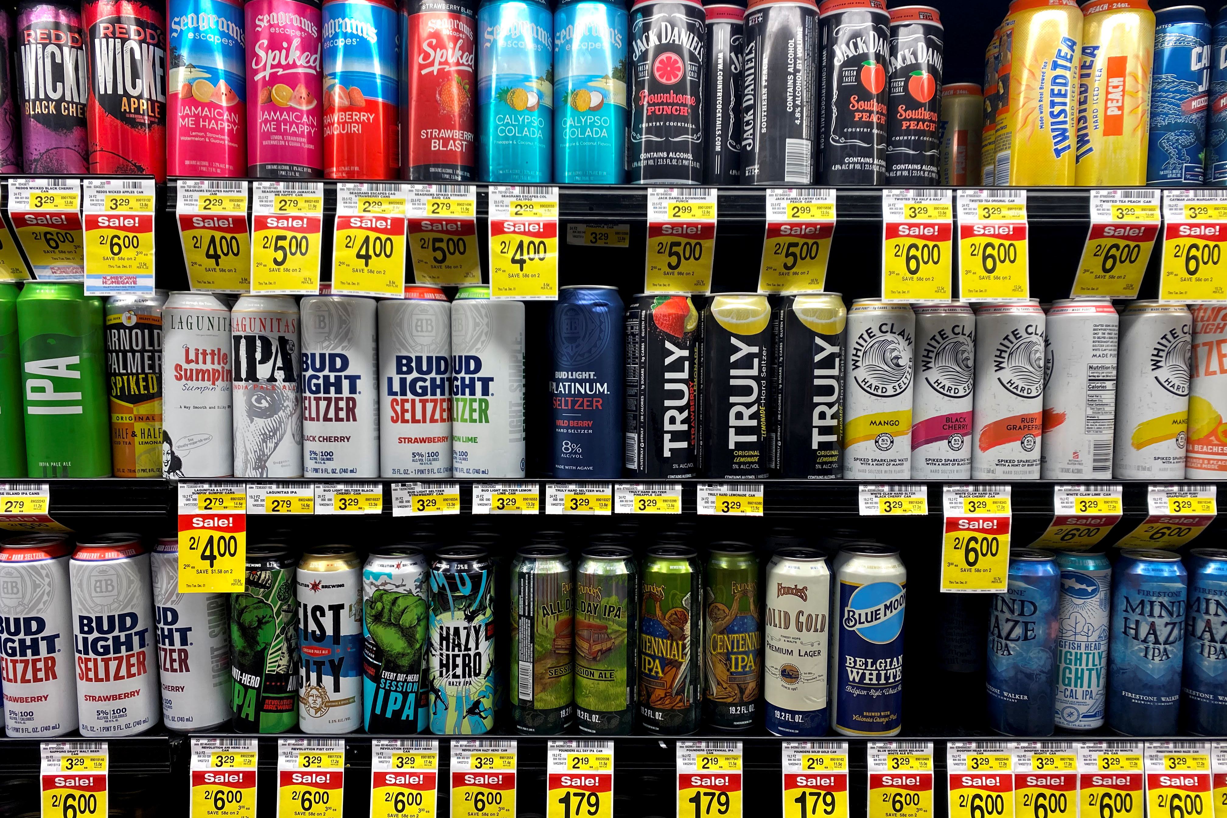 Cans of AB InBev's Bud Light hard seltzer are seen next to White Claw at Jewel-Osco supermarket in Chicago, October 21, 2020.