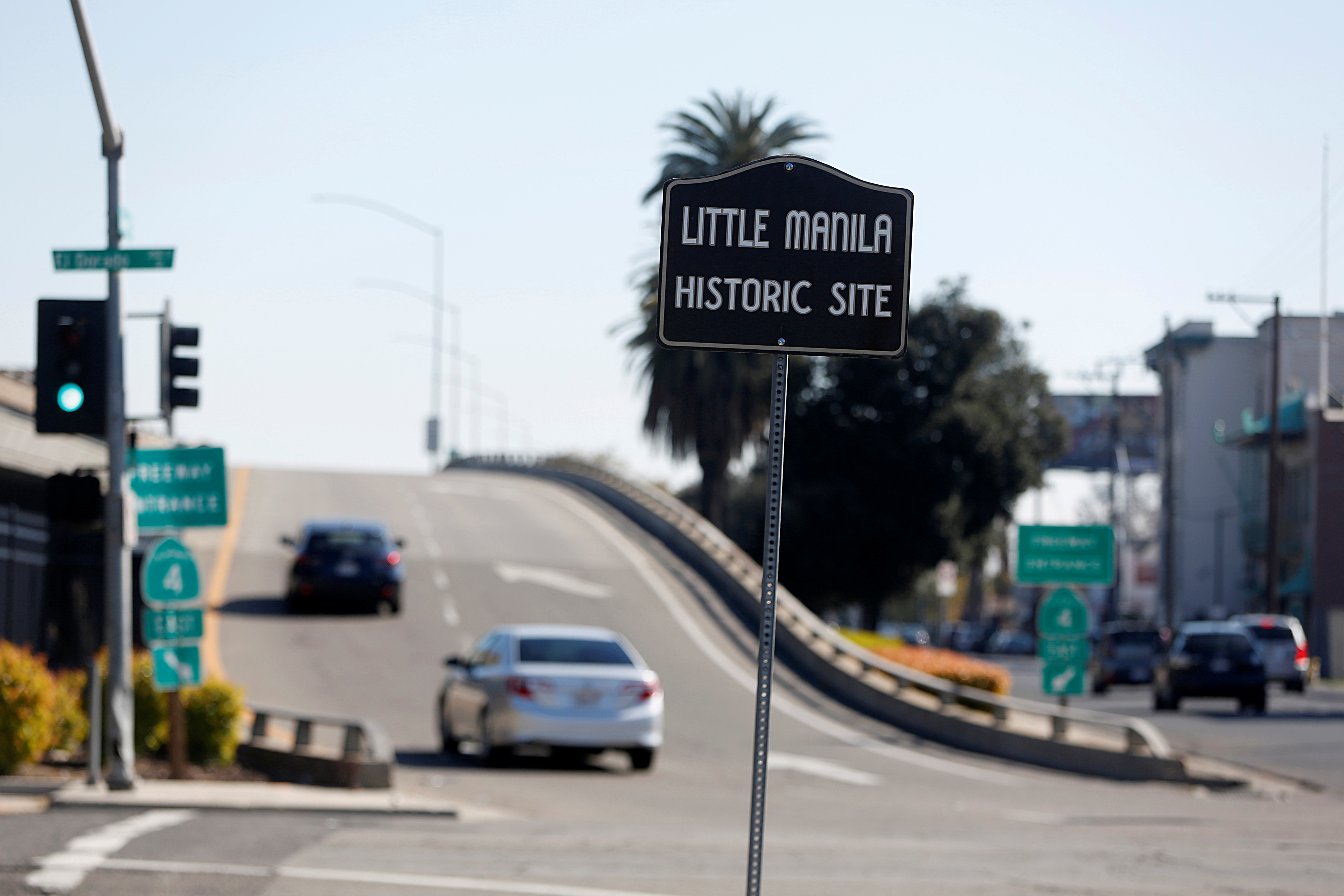 A sign marks the location of the historic site of Little Manila, of which now only two buildings still stand, in Stockton, California, U.S., March 12, 2021.  REUTERS/Brittany Hosea-Small