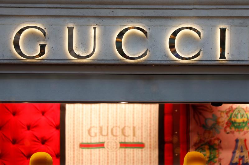 A Gucci sign is seen outside a shop in Paris
