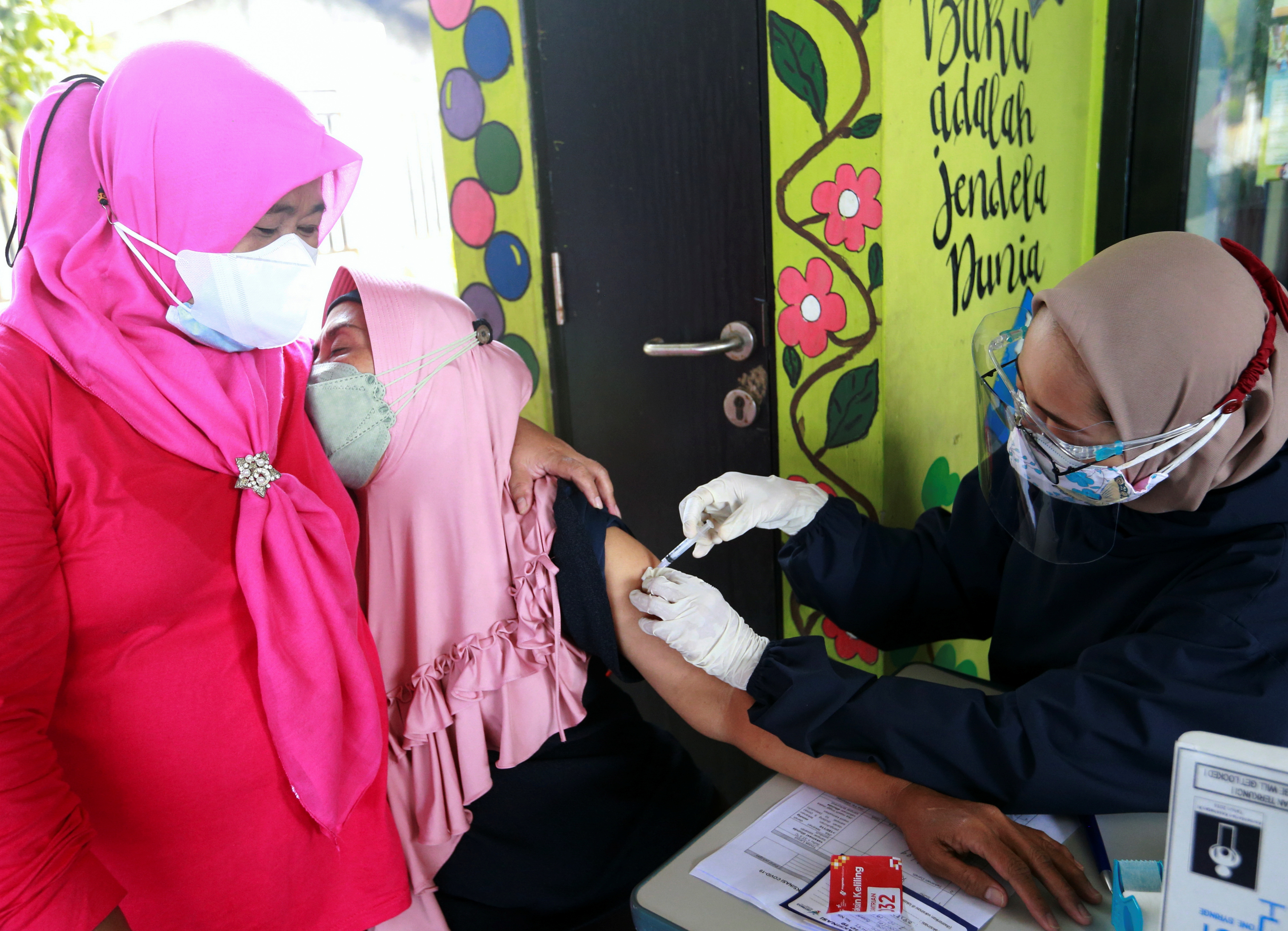 Vaccination rollout against COVID-19 as cases surge in Jakarta